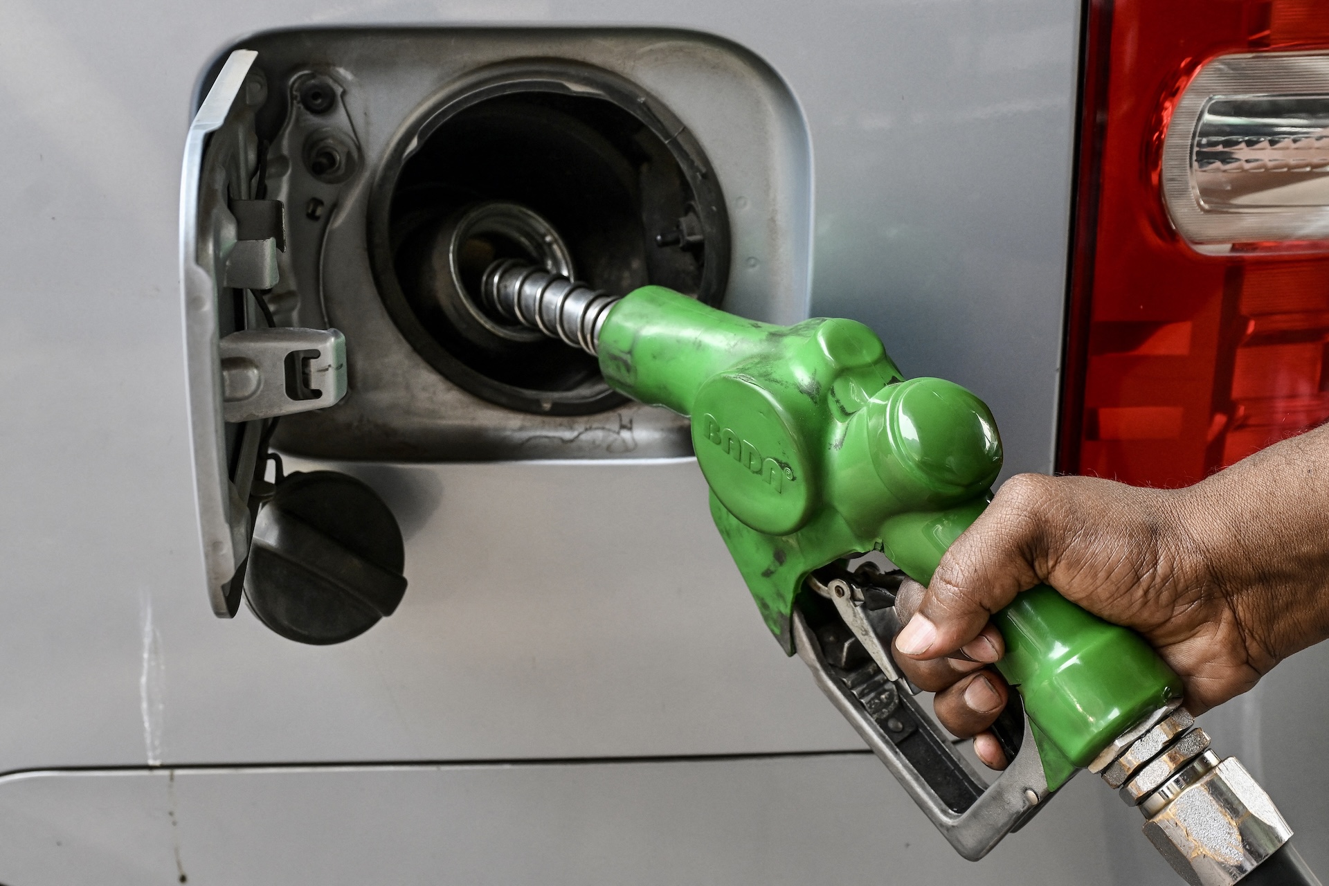 A worker refuels a car at a filling station in Dhaka on March 9, 2026. Bangladesh launched fuel rationing on March 8 as the war in the Middle East deepened an energy crunch, creating long queues at filling stations and boiling over into anger. 