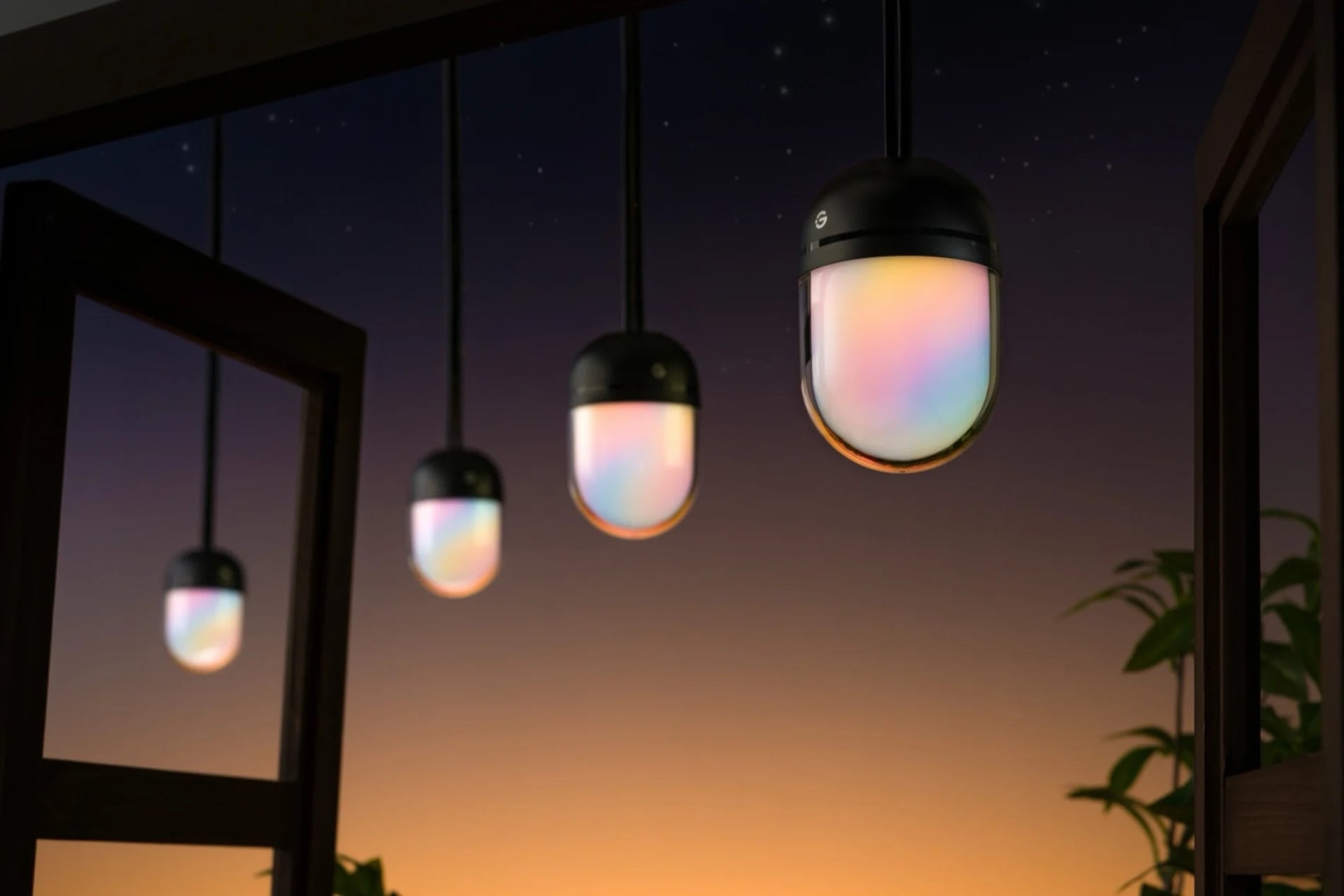 Govee Chromatic String Lights strung up against a backdrop that appears to mimic a sunset. The bulbs have sunset-style gradients inside of them, too.