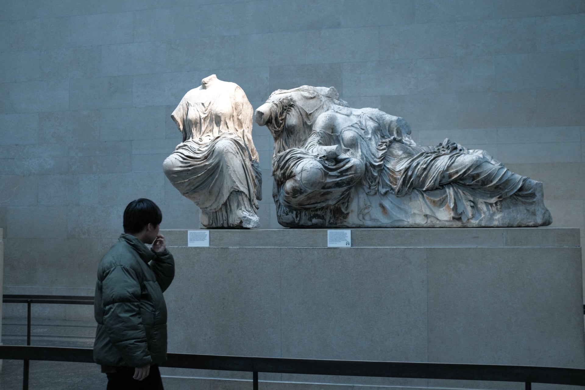 Visitors view the Parthenon Marbles, also known as the Elgin Marbles, at the British Museum in London.