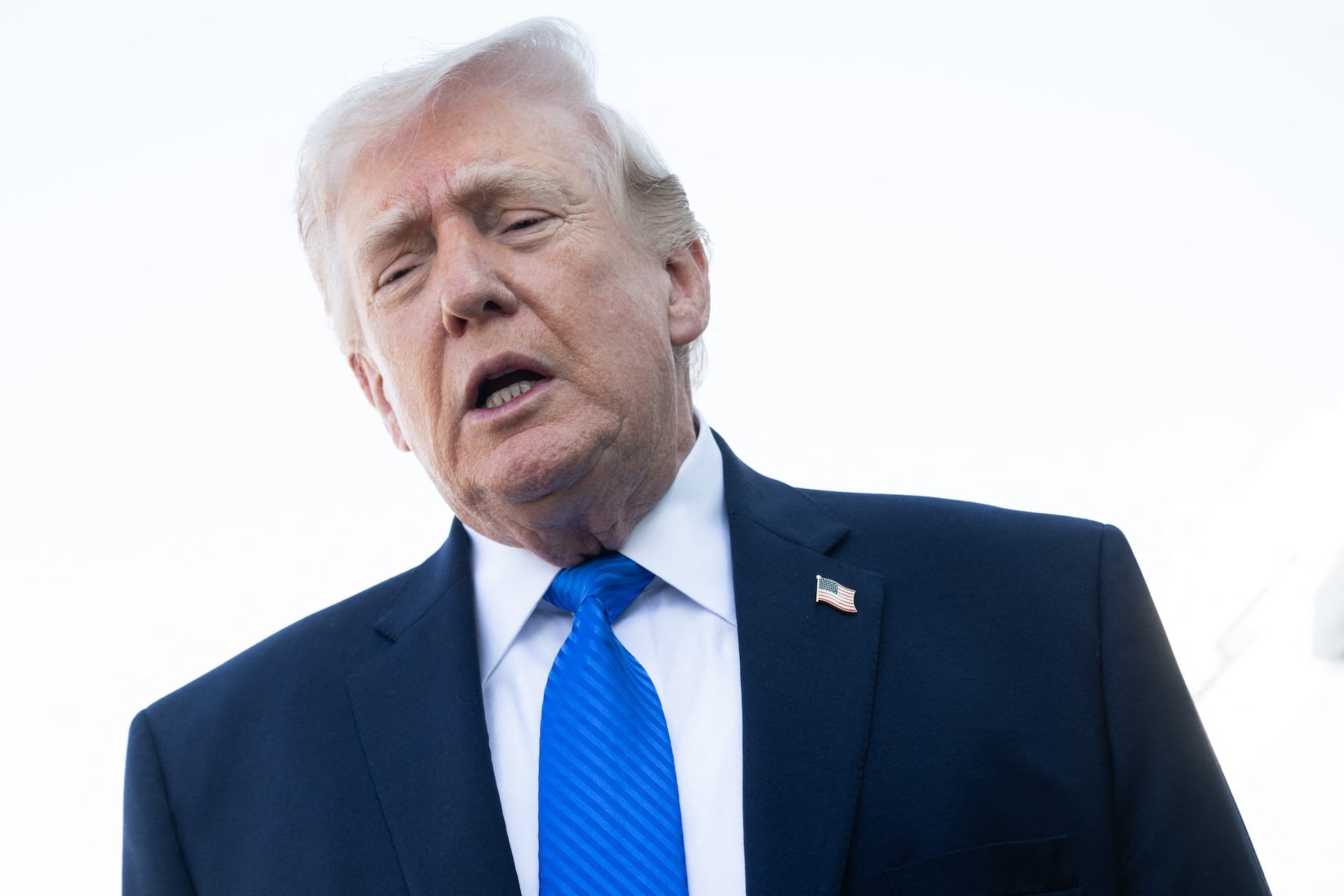 President Donald Trump speaks to reporters before boarding Air Force One at Palm Beach International Airport in West Palm Beach, Florida, on March 23, 2026.  