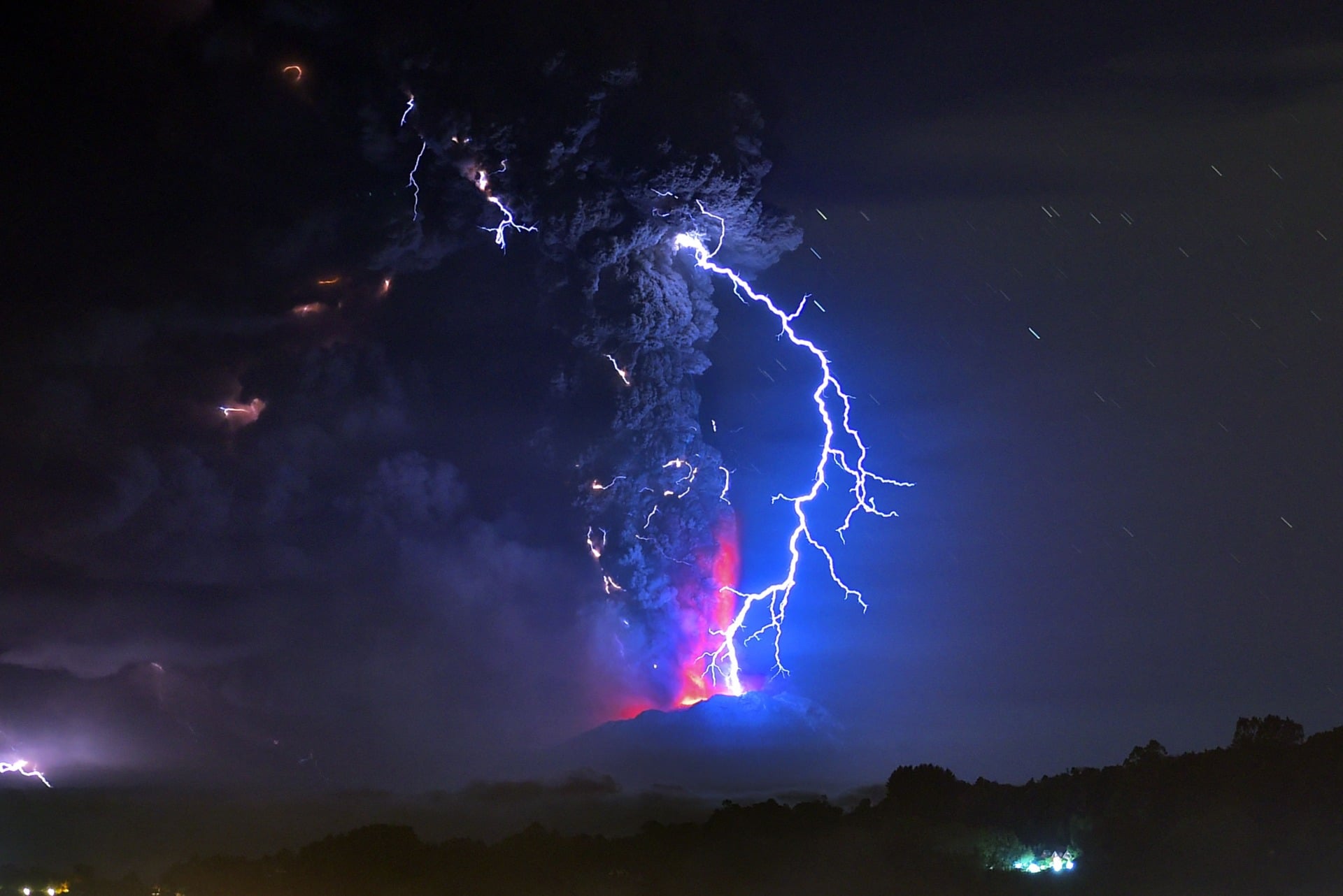 View from Frutillar, southern Chile, showing volcanic lightnings and lava spewed from the Calbuco volcano on April 23, 2015. 