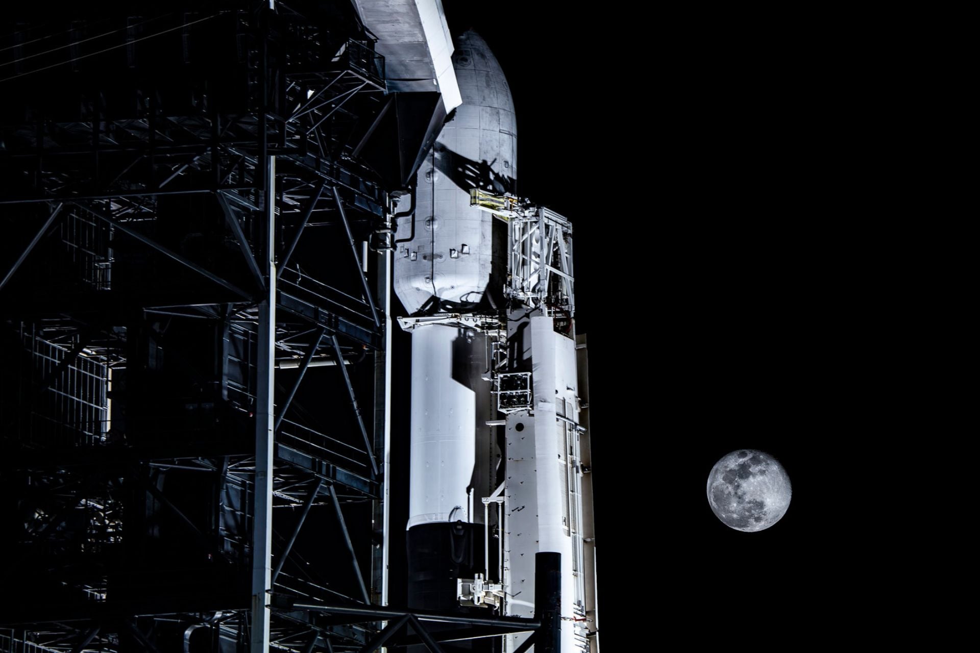 The SpaceX Falcon 9 rocket before it launched Blue Ghost Mission 1 in January 2025, pictured on the launch pad beneath a full Moon