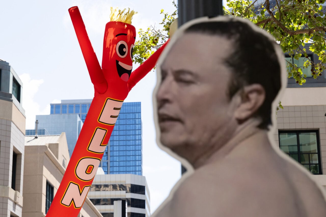 JA sign depicting Elon Musk is displayed outside the courthouse at the Ronald V. Dellums Federal Building as jury selection begins in the lawsuit between Elon Musk and OpenAI on April 27, 2026 in Oakland, California. Elon Musk invested in OpenAI early on believing it would be a non-profit, but is now suing OpenAI and its CEO Sam Altman for allegedly deceiving him by developing OpenAI into a for-profit company.