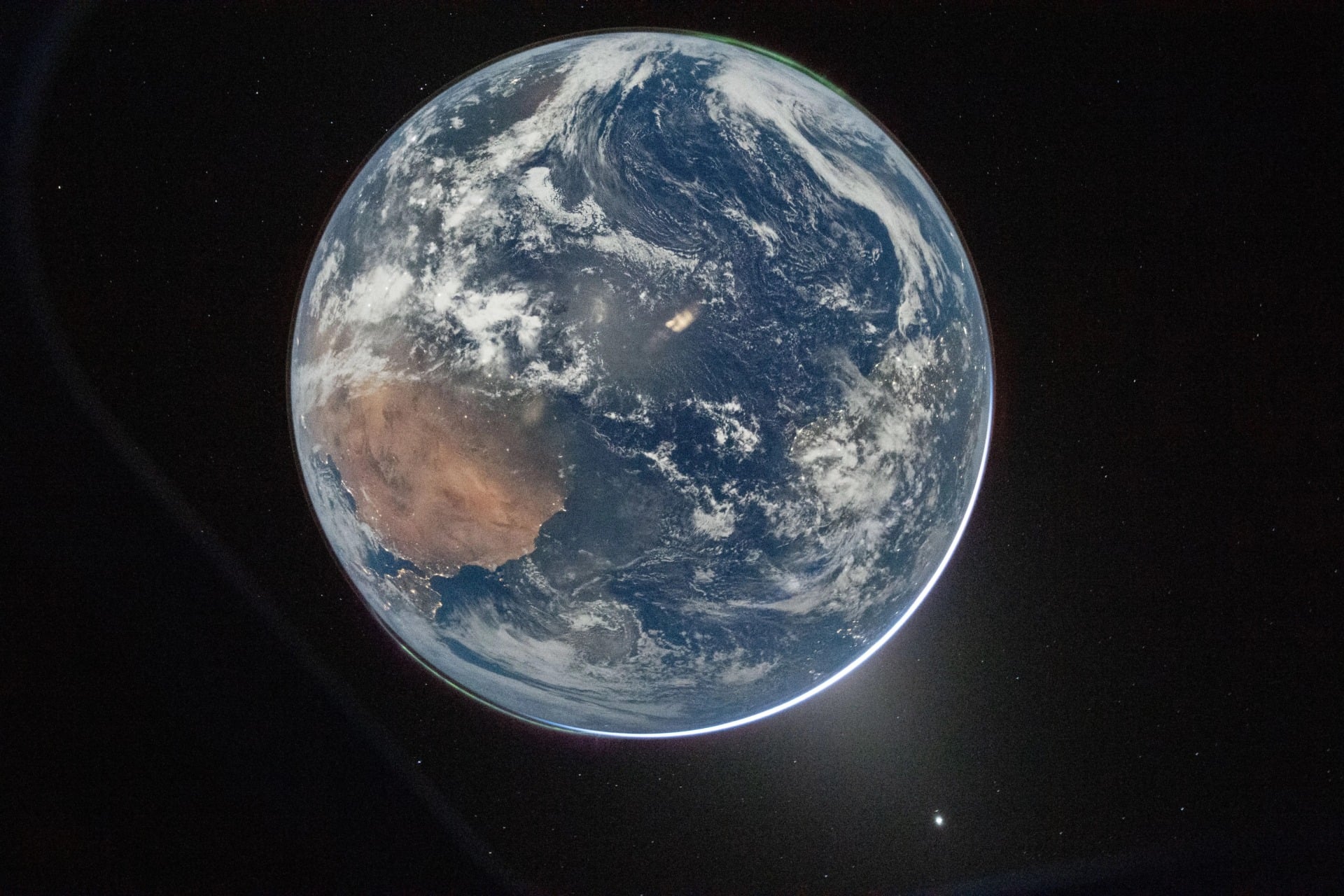 NASA astronaut and Artemis 2 commander Reid Wiseman took this photo of Earth from the Orion spacecraft’s window after completing the translunar injection burn on Thursday, April 2, 2026 