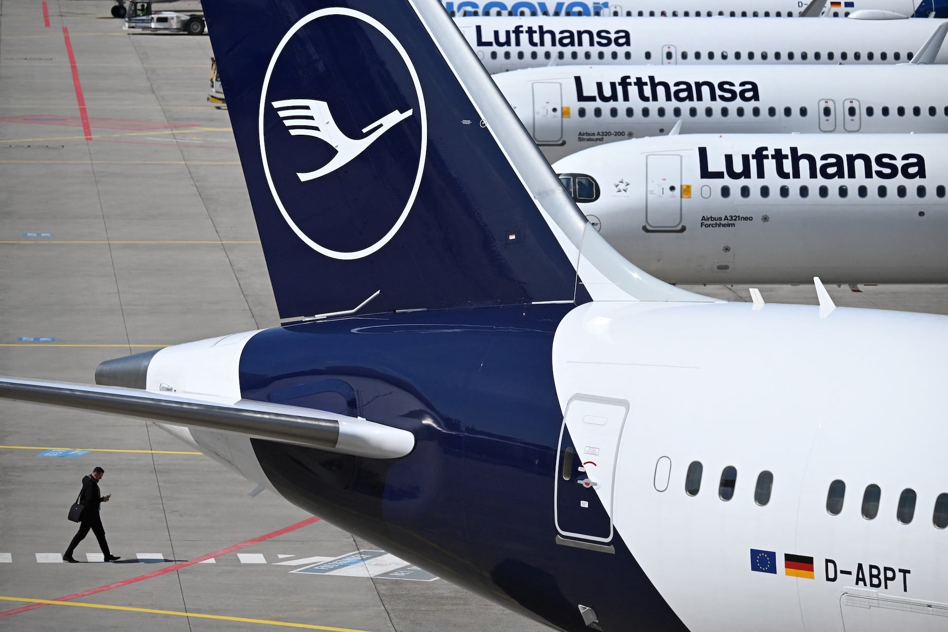  The logo of German airline Lufthansa is seen on several aircraft on the tarmac at Frankfurt Airport, Frankfurt am Main, western Germany, on April 15, 2026. 