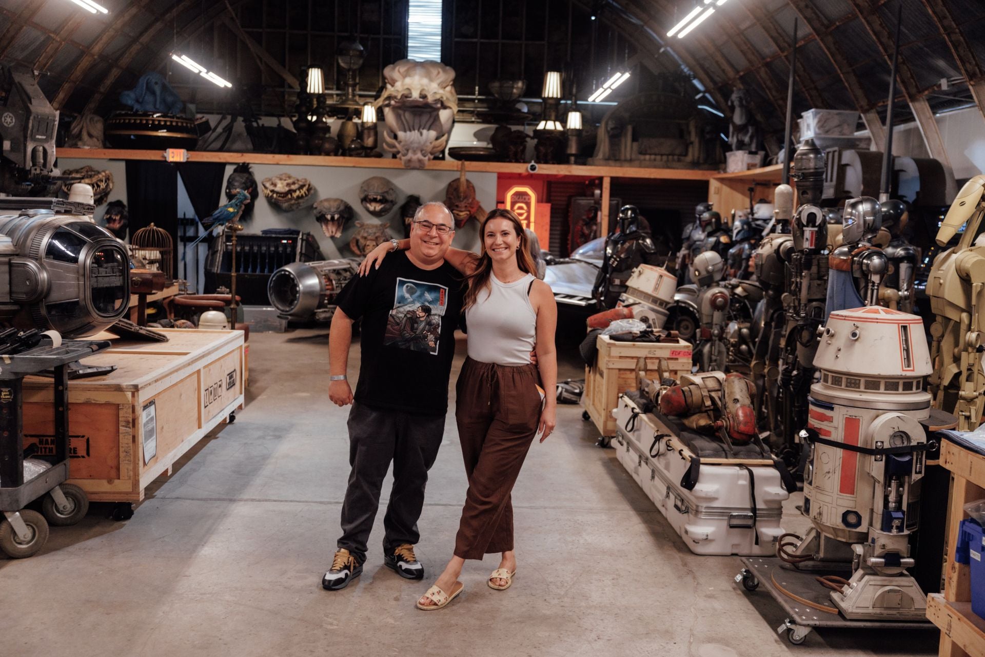 io9's Germain Lussier (with Screenrant's Ash Crossan) in a warehouse full of 'Star Wars' props.