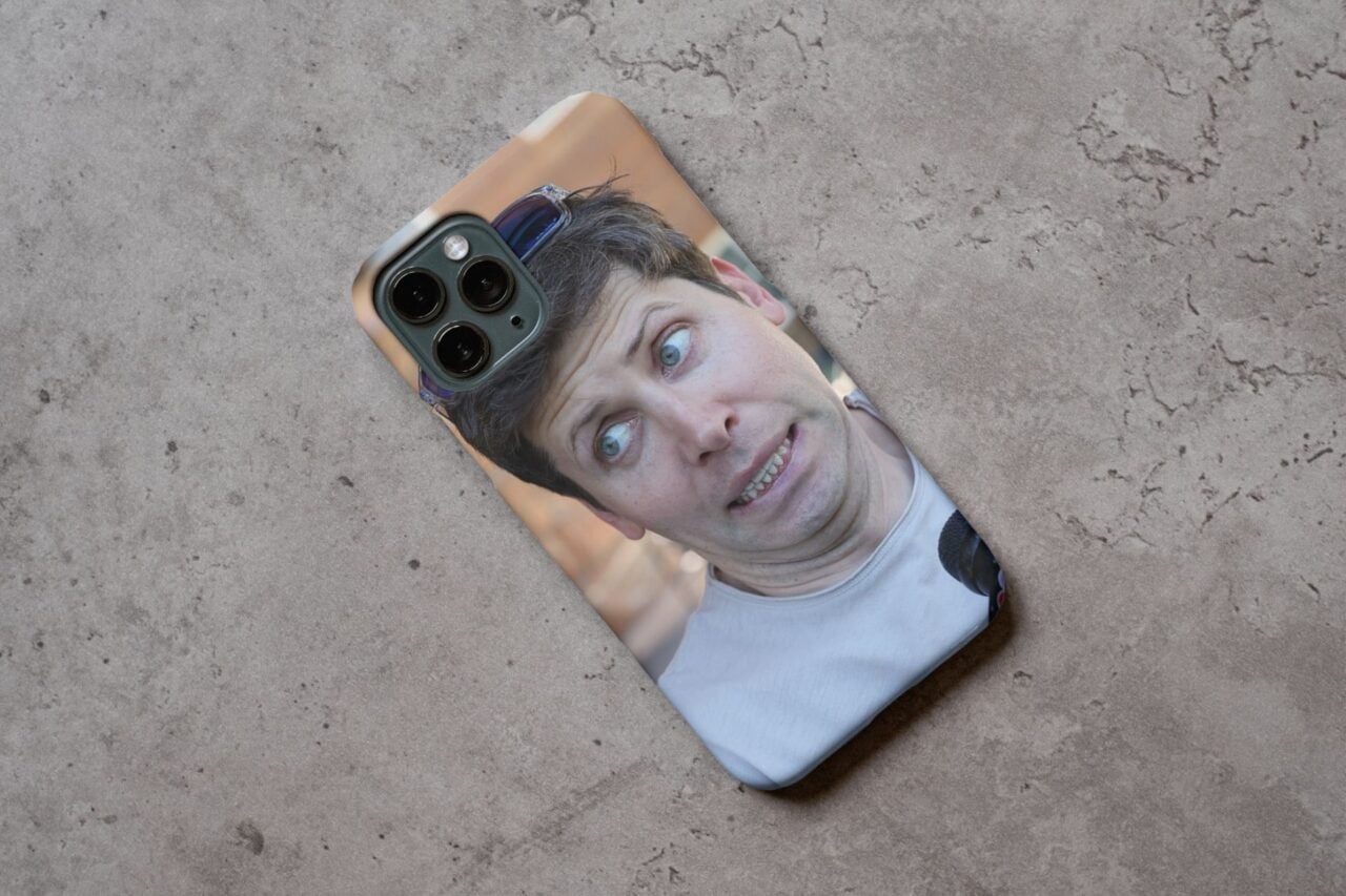 A mockup of Sam Altman's face on the back of a phone.
