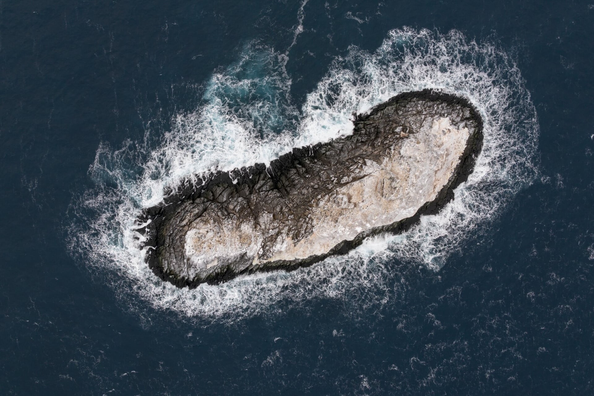 Above, an aerial view of the newly discovered—and still unnamed—uncharted island, discovered this year by polar researchers in the Weddell Sea.