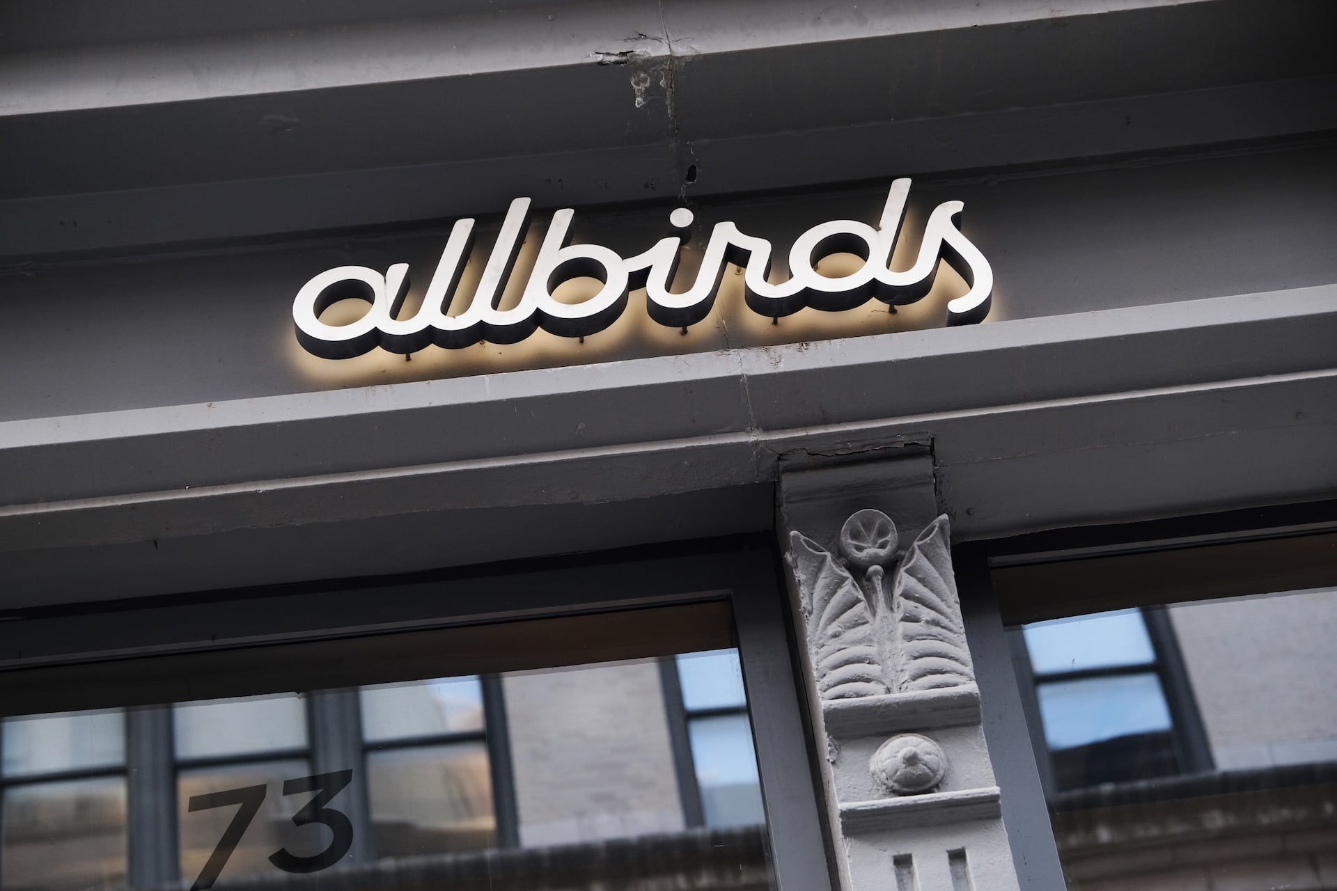 The sign above an Allbirds retail store in what is clearly a New York City building