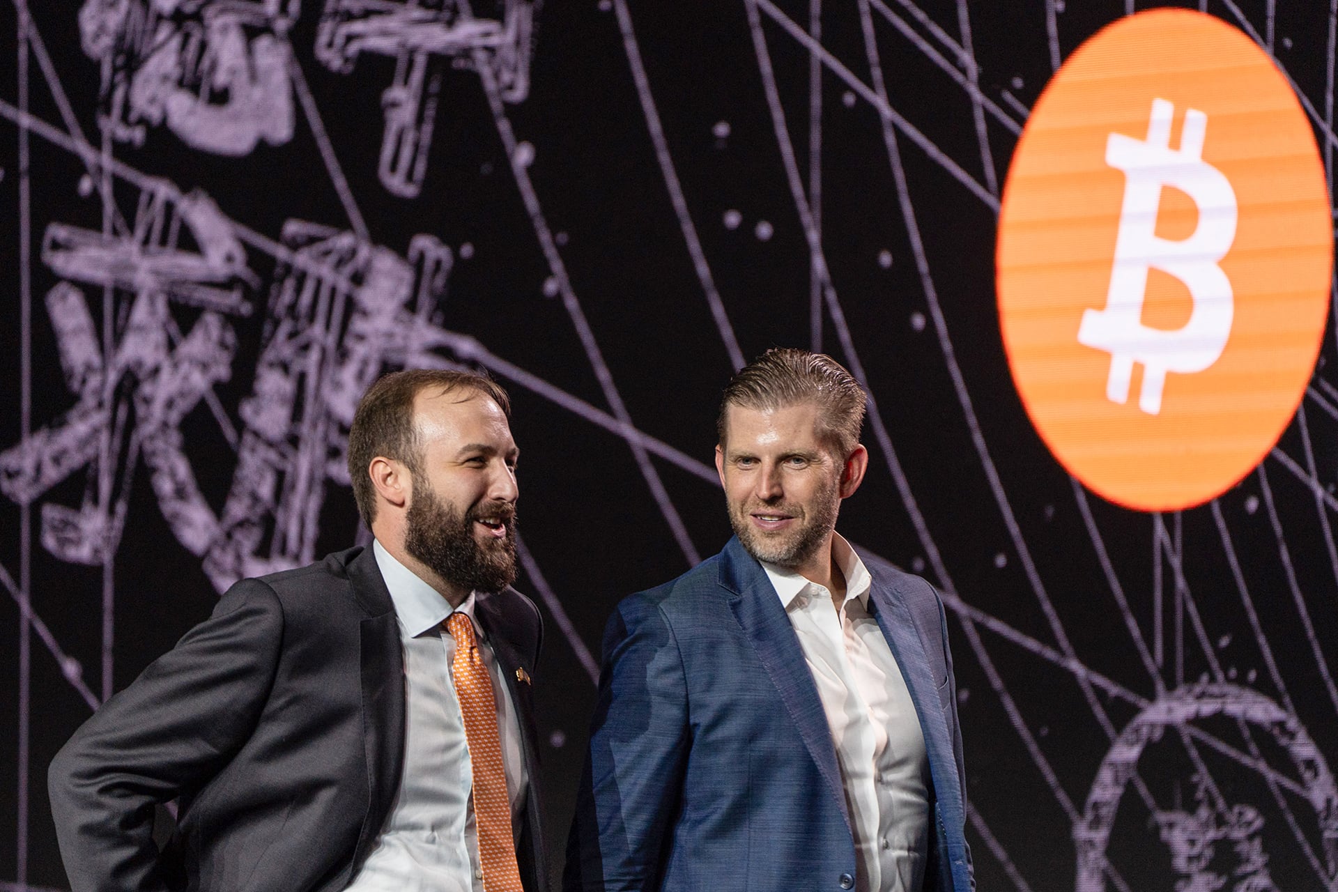 David Bailey (L), CEO of BTC Inc, and Eric Trump, third child and second son of US President Donald Trump, leave after speaking during the Bitcoin Asia 2025 conference at the Hong Kong Convention and Exhibition Centre in Hong Kong on August 29, 2025.
