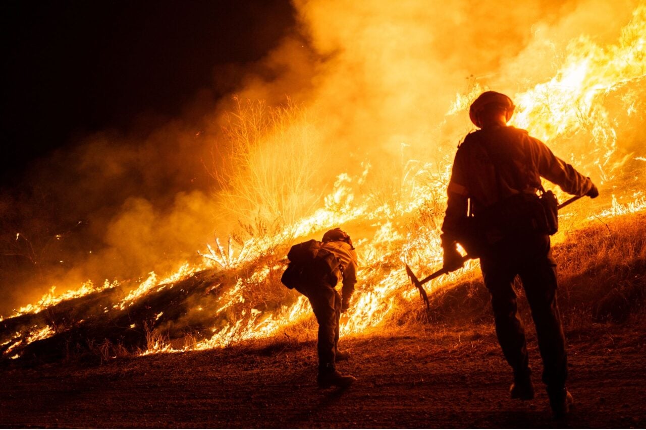 Firefighters work as the Hughes Fire burns on January 22, 2025 in Castaic, California