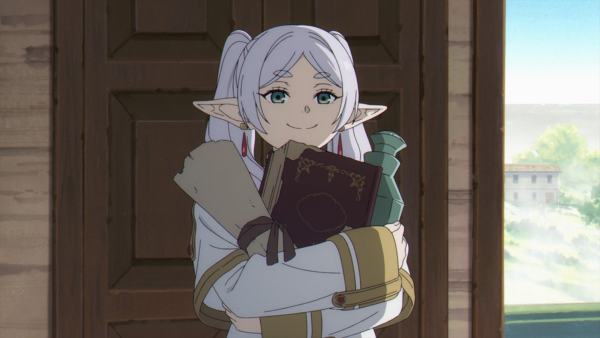 Frieren Beyond Journey's End still of Frieren carrying spell books and trinkets.
