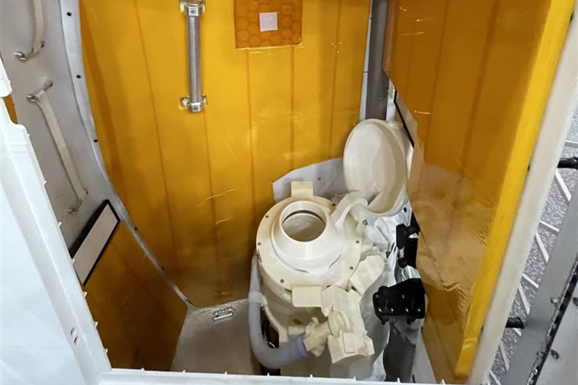 A mock-up of the Universal Waste Management System aboard the Orion spacecraft 