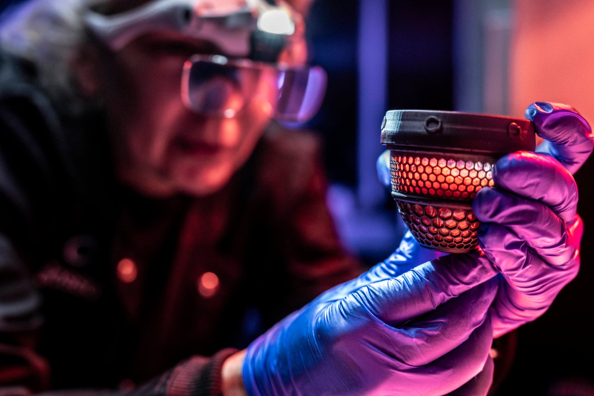 A member of Colossal's team conducts a wellness check on a test chicken gestating in the firm's artificial egg.