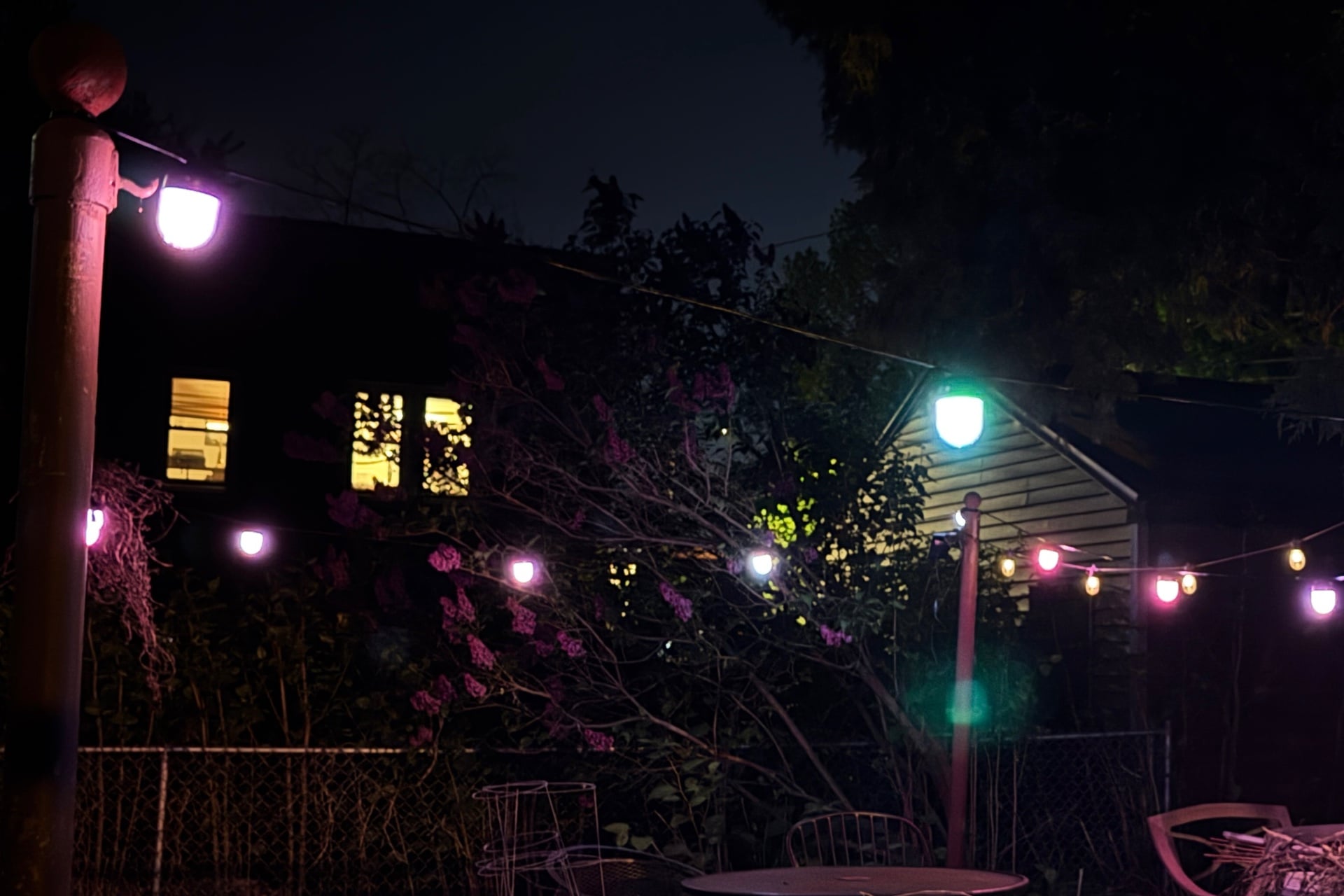 Picture of the Govee string lights in a patio at night. Features of the patio are barely visible.