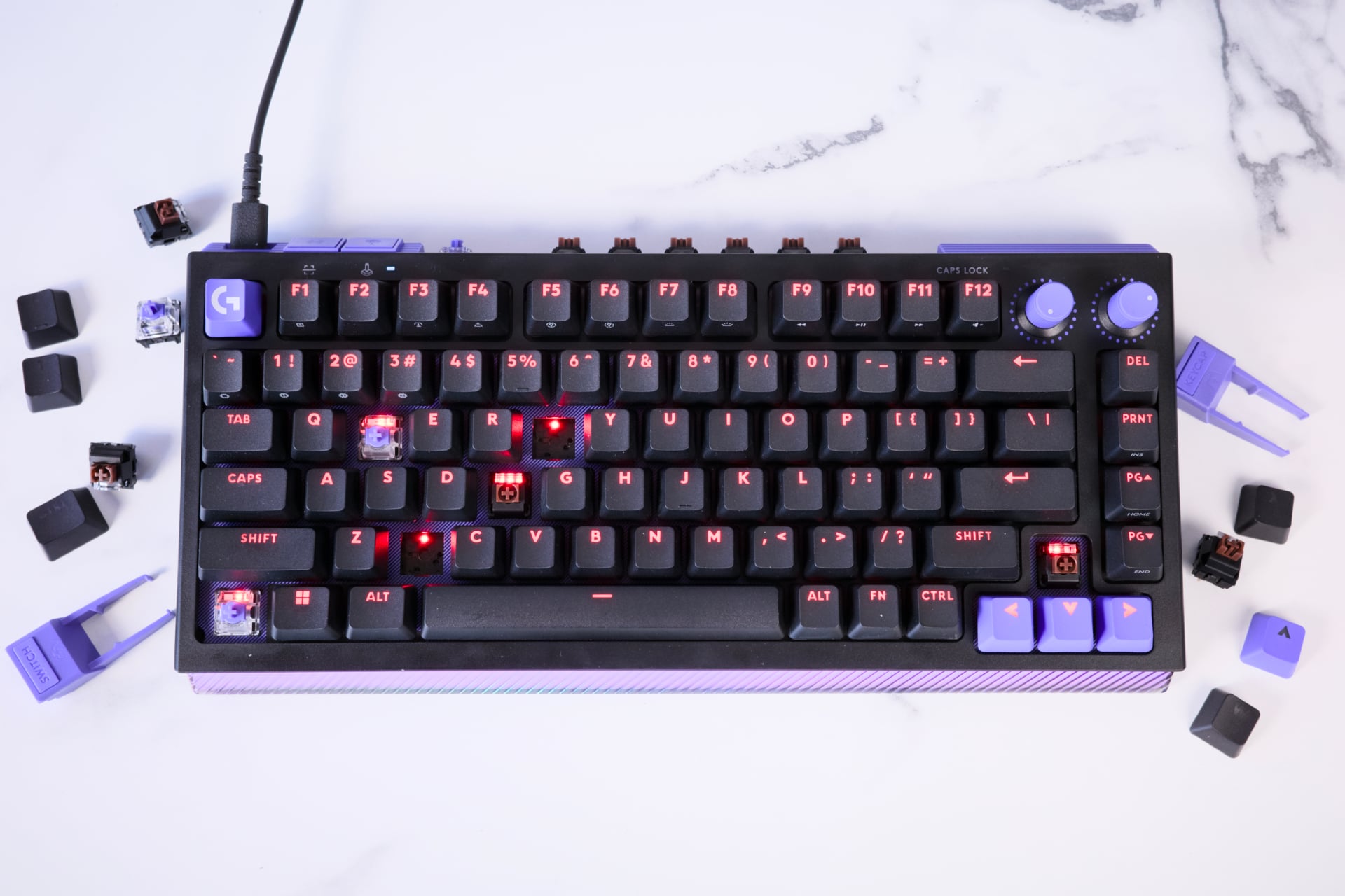 Logitech's keyboard includes both analog and mechanical switches that you can slot in yourself.