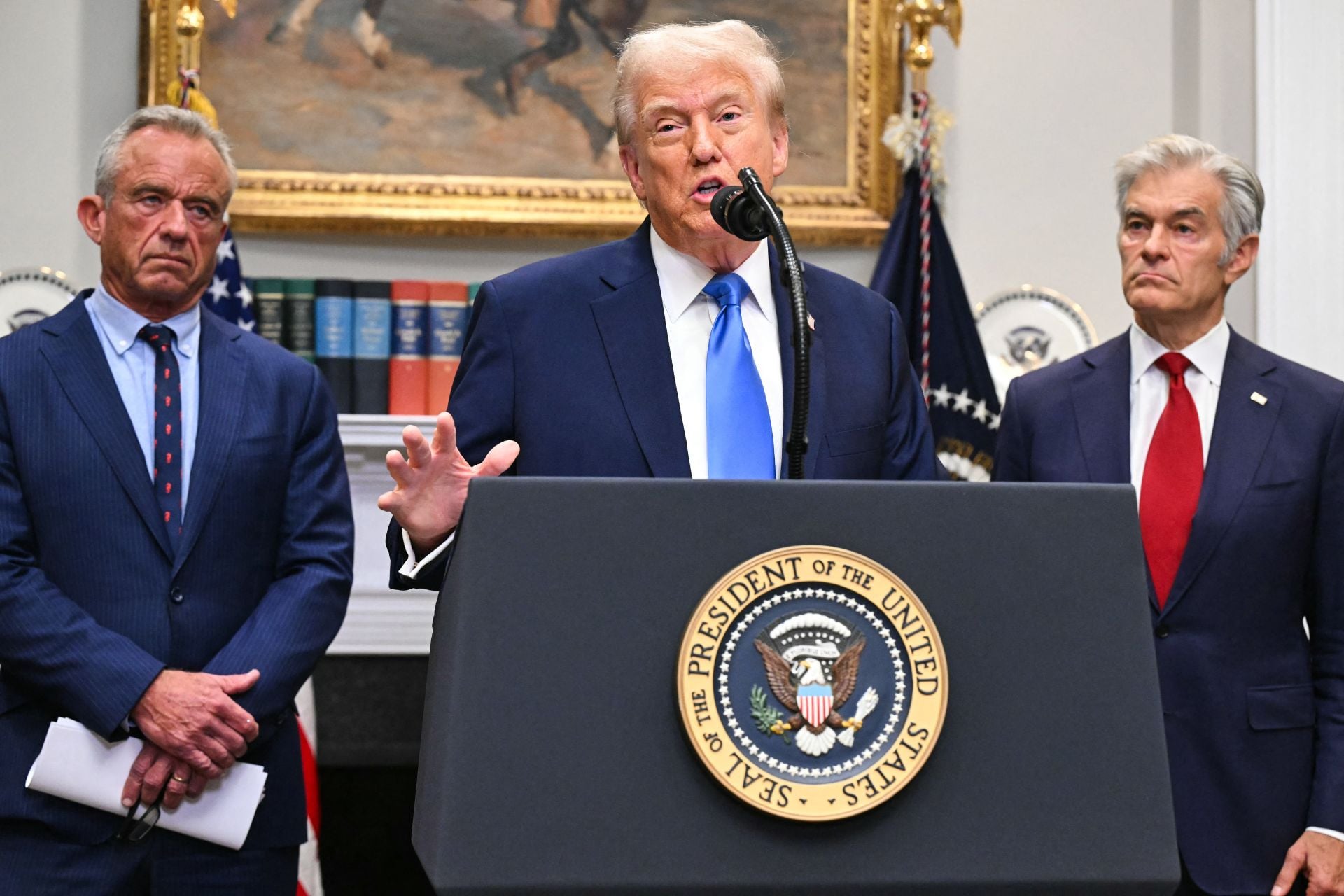 President Donald Trump, alongside Secretary of Health and Human Services Robert F. Kennedy Jr. and Medicare and Medicaid Administrator Mehmet Oz, speaking about autism at a press conference held on September 22, 2025. 