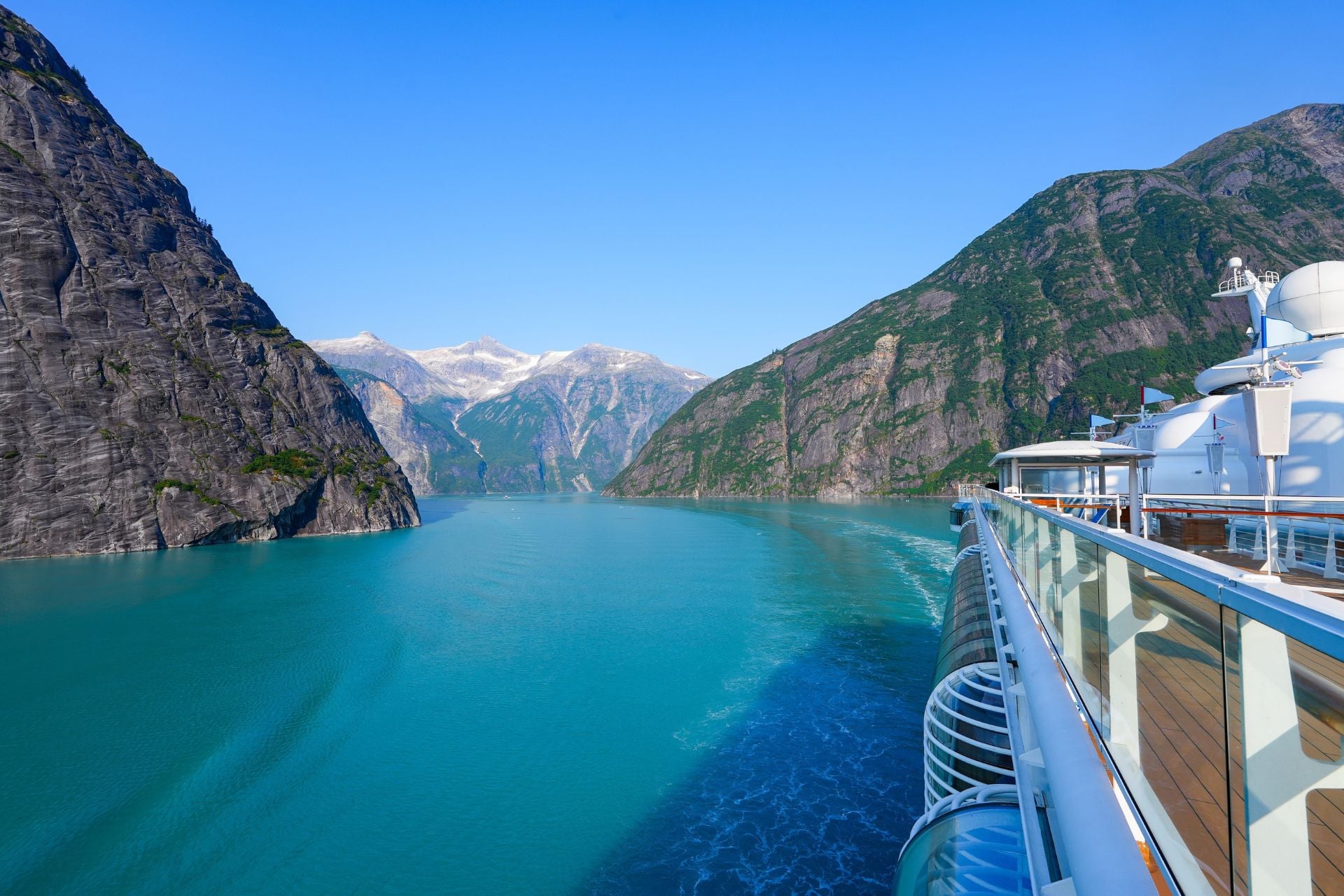 A cruise ship navigates the narrow Tracy Arm fjord near Juneau, Alaska.