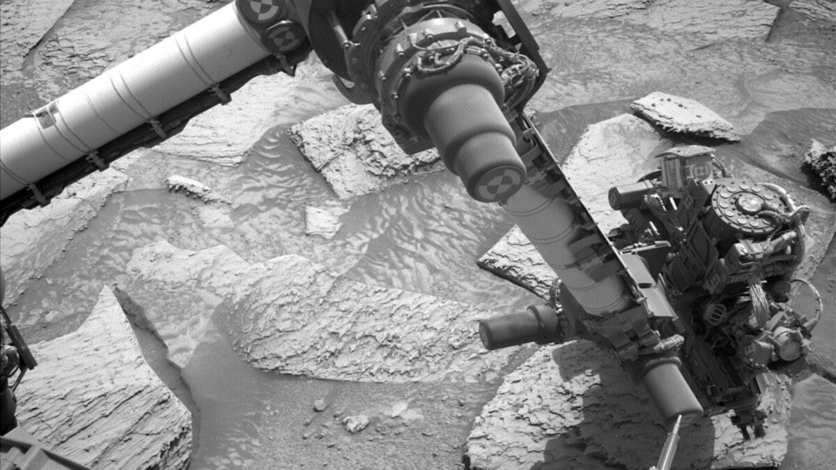 Watch NASA’s Curiosity Rover Struggle to Break Loose From a Rock on Mars
