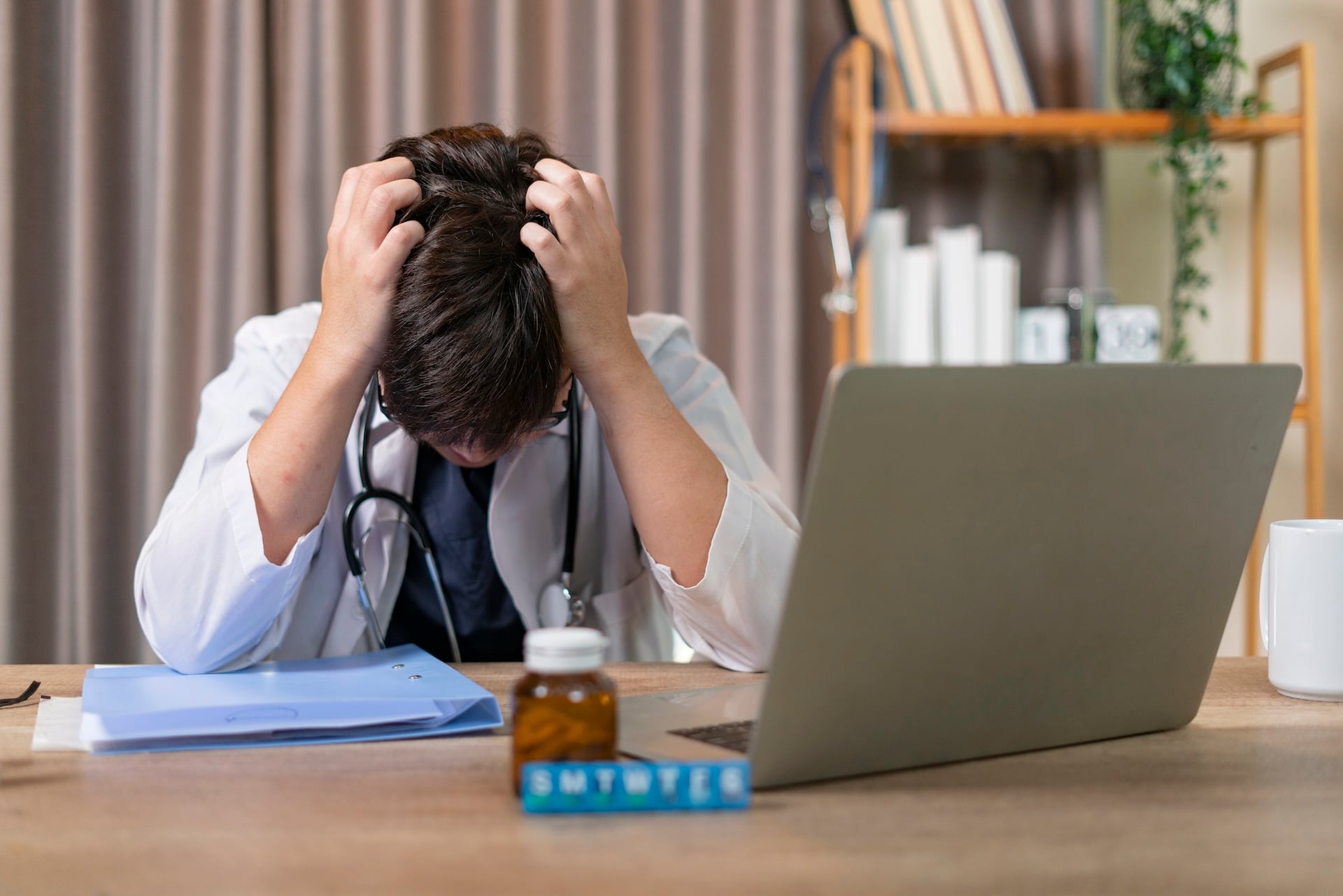 The Doctor Sat Stressed About His Work In The Hospital.