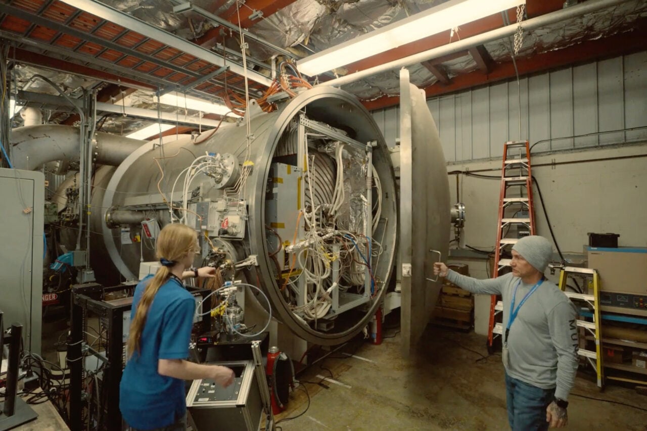 The prototype thruster is enclosed in JPL’s condensable metal propellant (CoMeT) vacuum facility, a unique national asset designed to safely test thrusters using metal-vapor propellants as part of potential megawatt-class electric propulsion systems.
