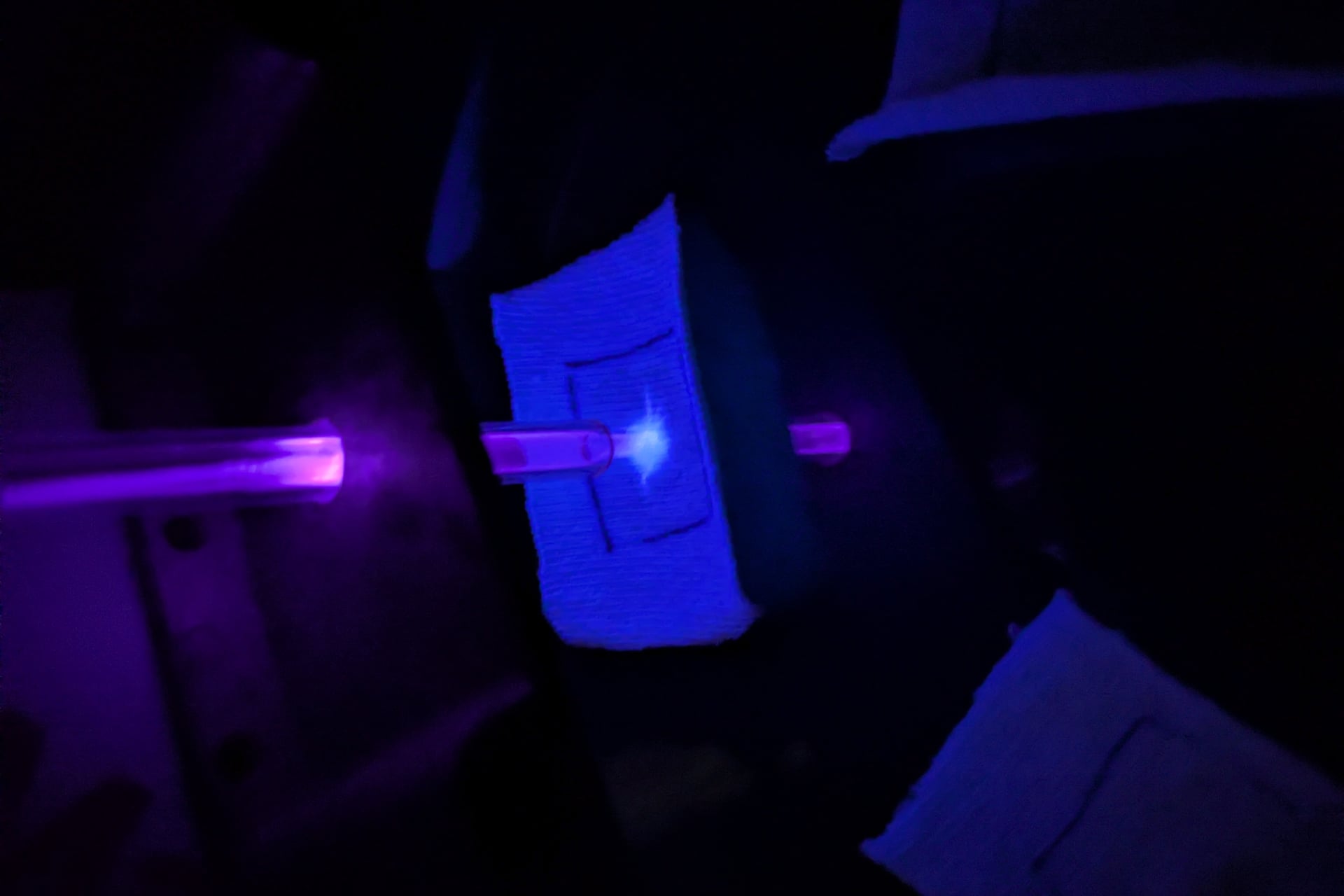 A cotton coupon getting treated with a "laundry gun" meant to kill bacteria.