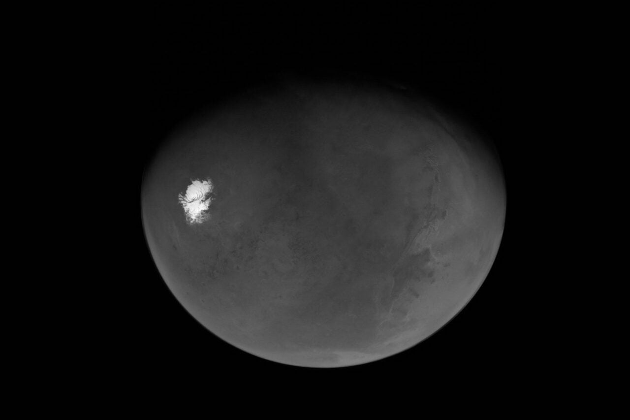 This is the first view of a nearly “full Mars” as seen by NASA’s Psyche spacecraft shortly after its closest approach to the planet on May 15, 2026. The view extends from the south polar cap northwards to the Valles Marineris canyon system and beyond
