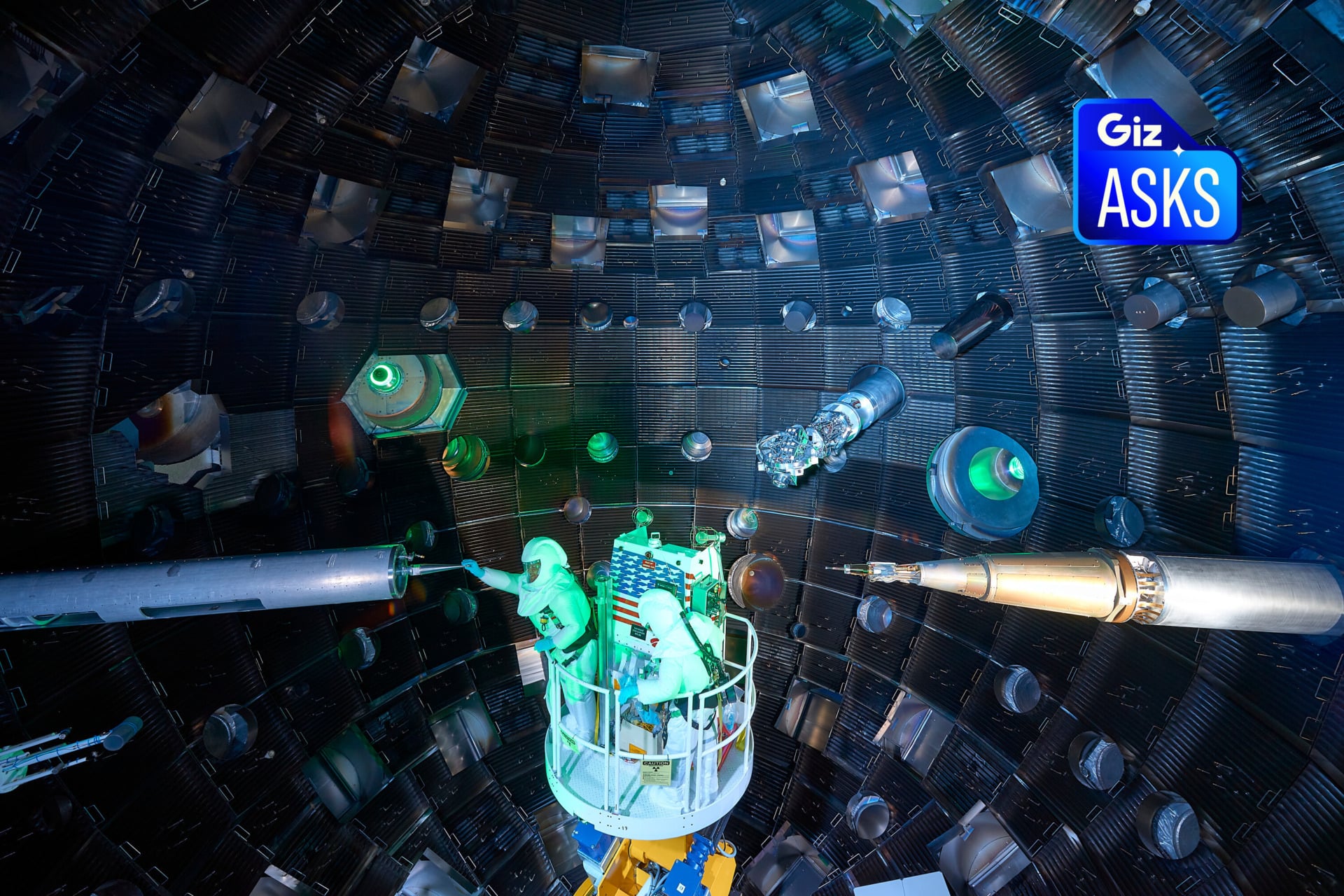 Staff inspect the interior of the chamber and diagnostic equipment at the National Ignition Facility at Lawrence Livermore National Laboratory. 