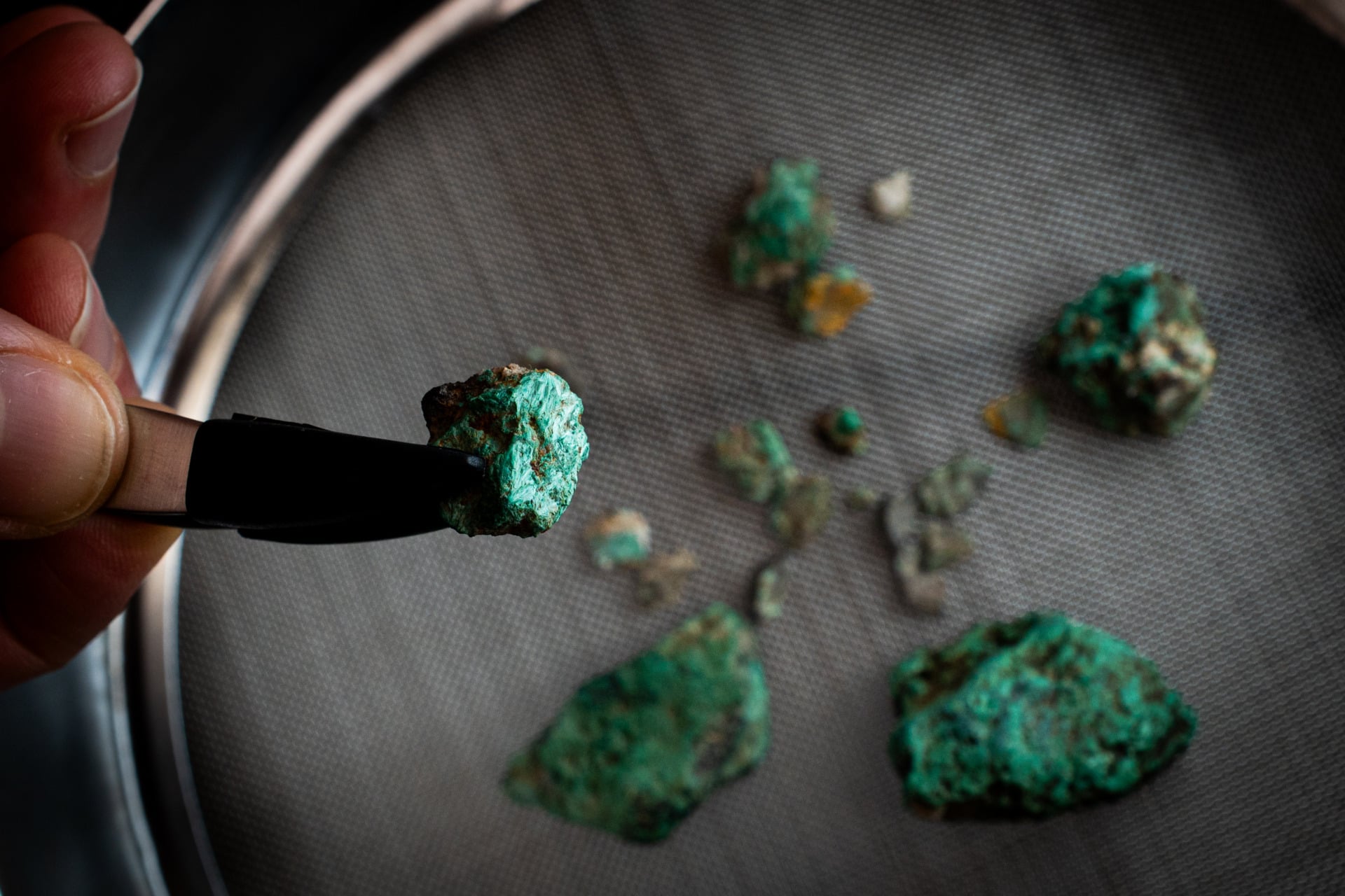 Malachite fragments, a mineral rich in copper, recovered during the excavation works at Cave 338.