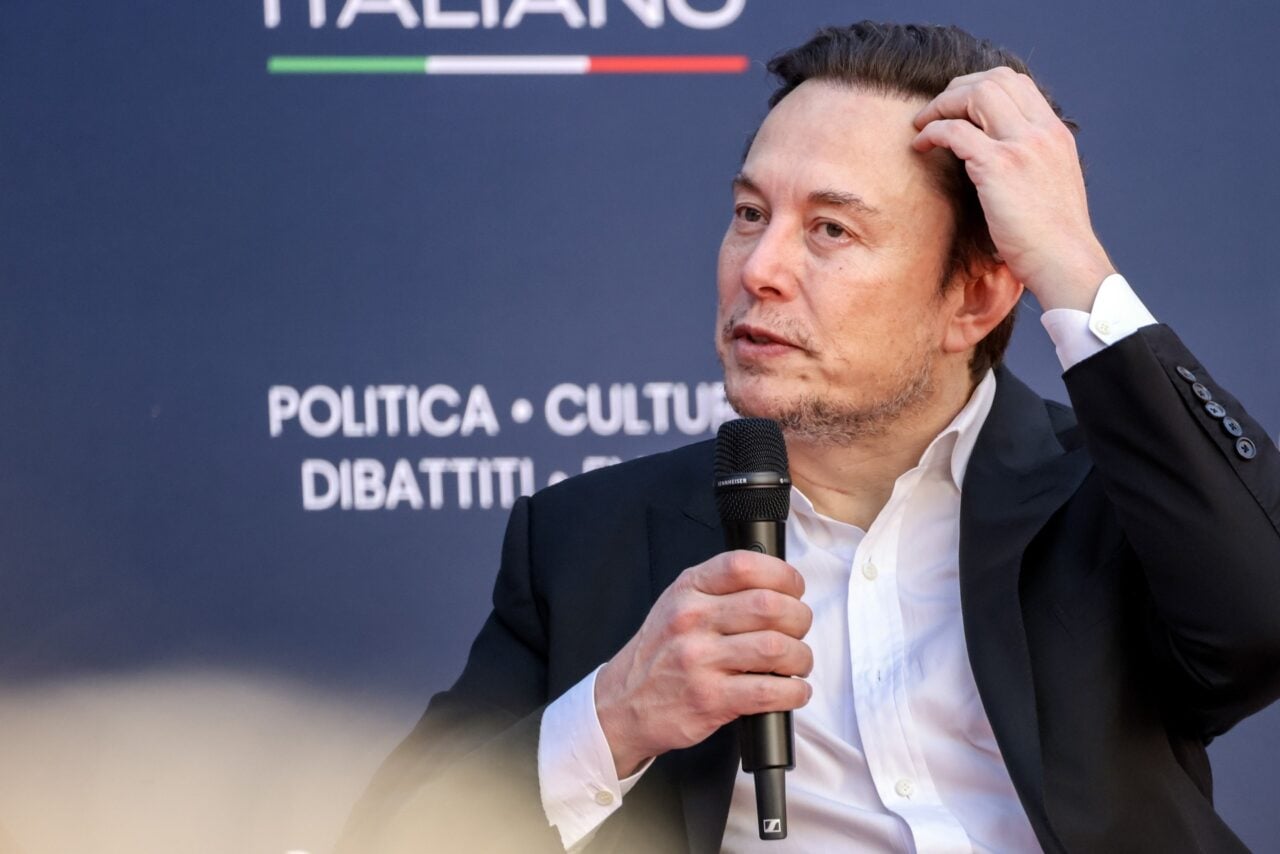 Elon Musk scratches his head