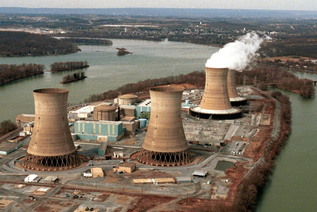 The view looking towards Middletown Pennsylvania reveals Three Mile Island and the damaged reactor number two in the foreground, March 15, 1999 in Middletown, PA.