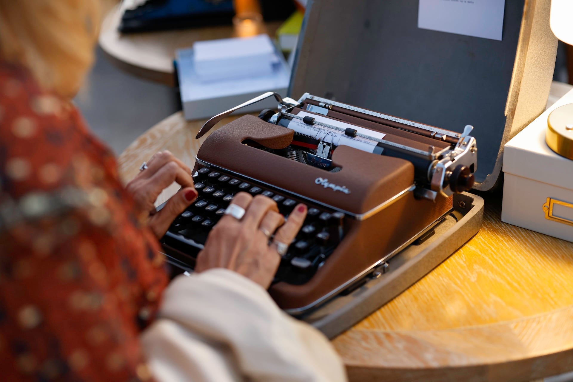 A person typing on a typewriter