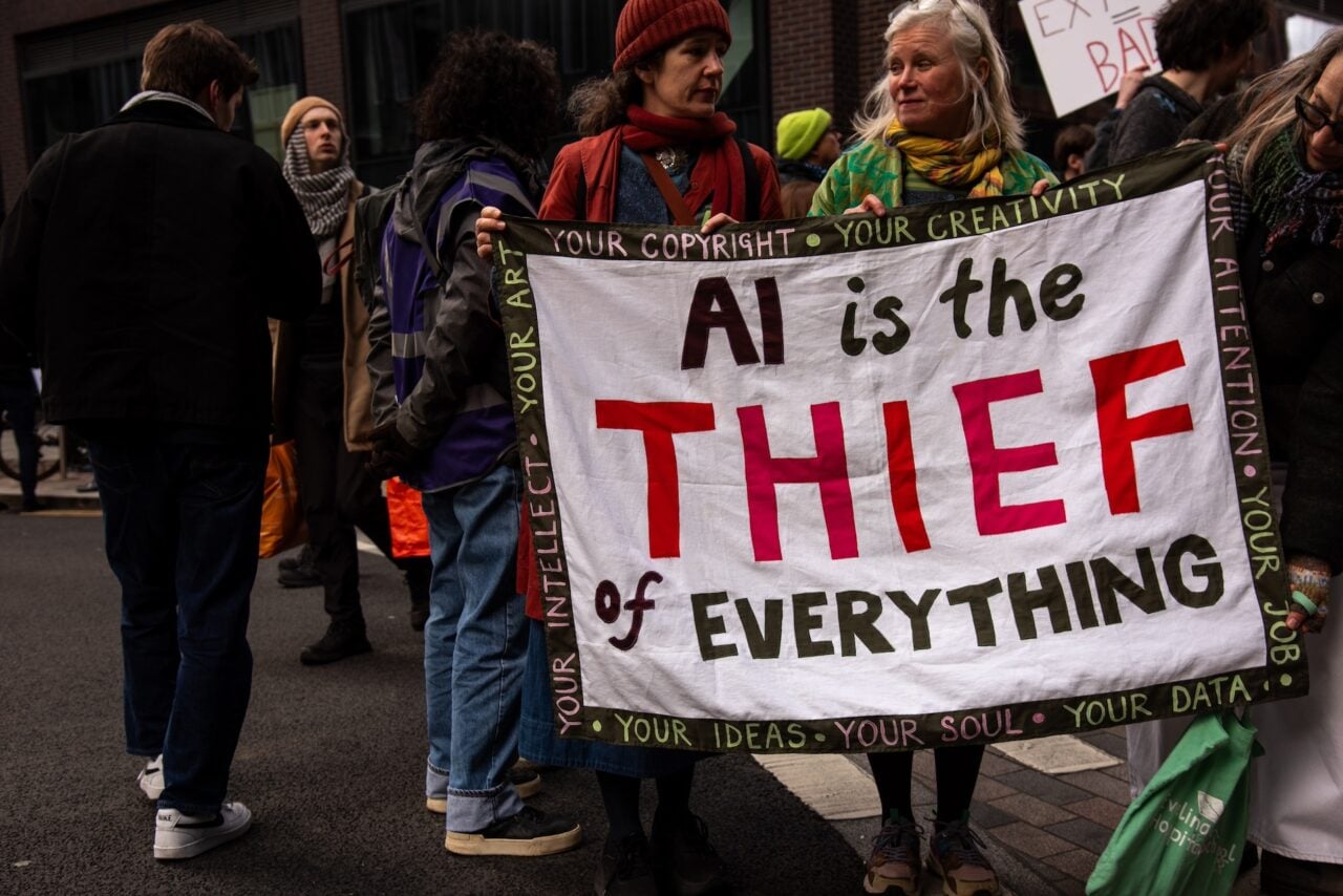 A protestor holds a sign during the "March Against the Machines" in London in February 2026.