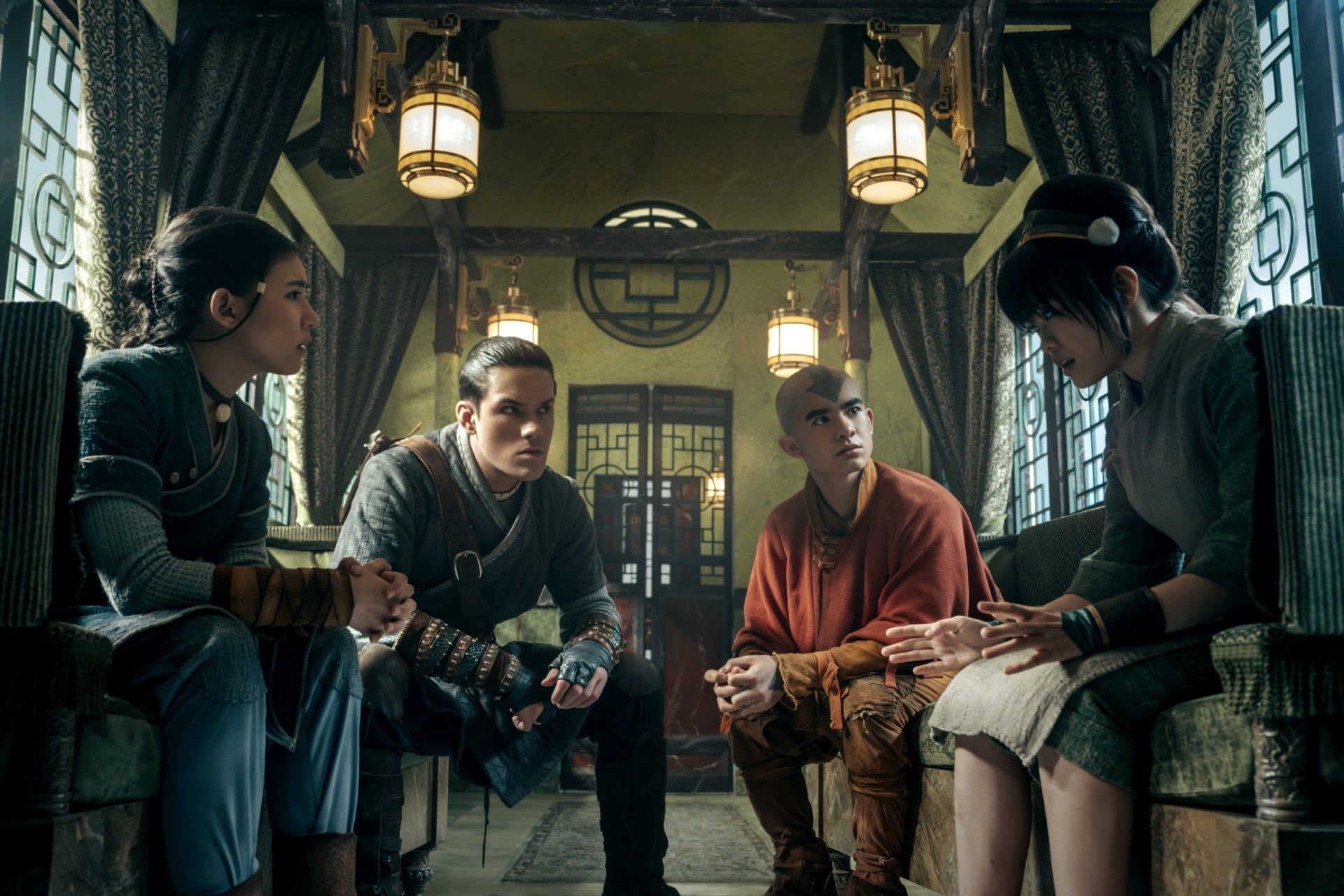 Avatar: The Last Airbender still of Sokka, Aang, Katara and Toph talking.