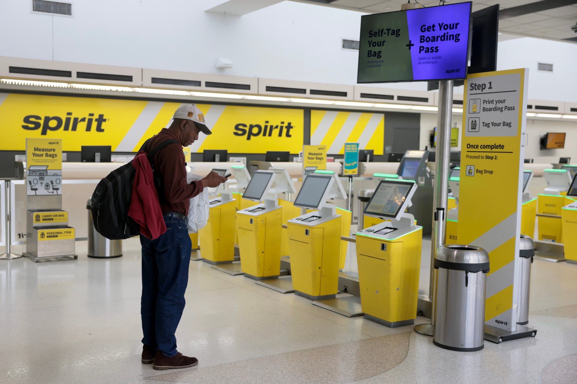 Spirit airlines check-in counter at an airport almost entirely empty post shutdown