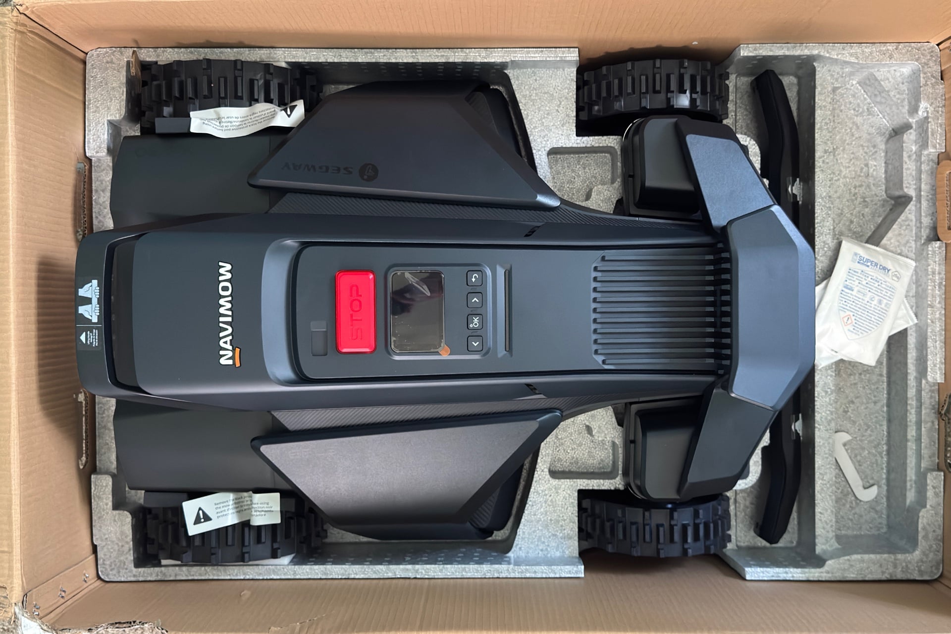 Navimow X430 in its box, pictured from above.