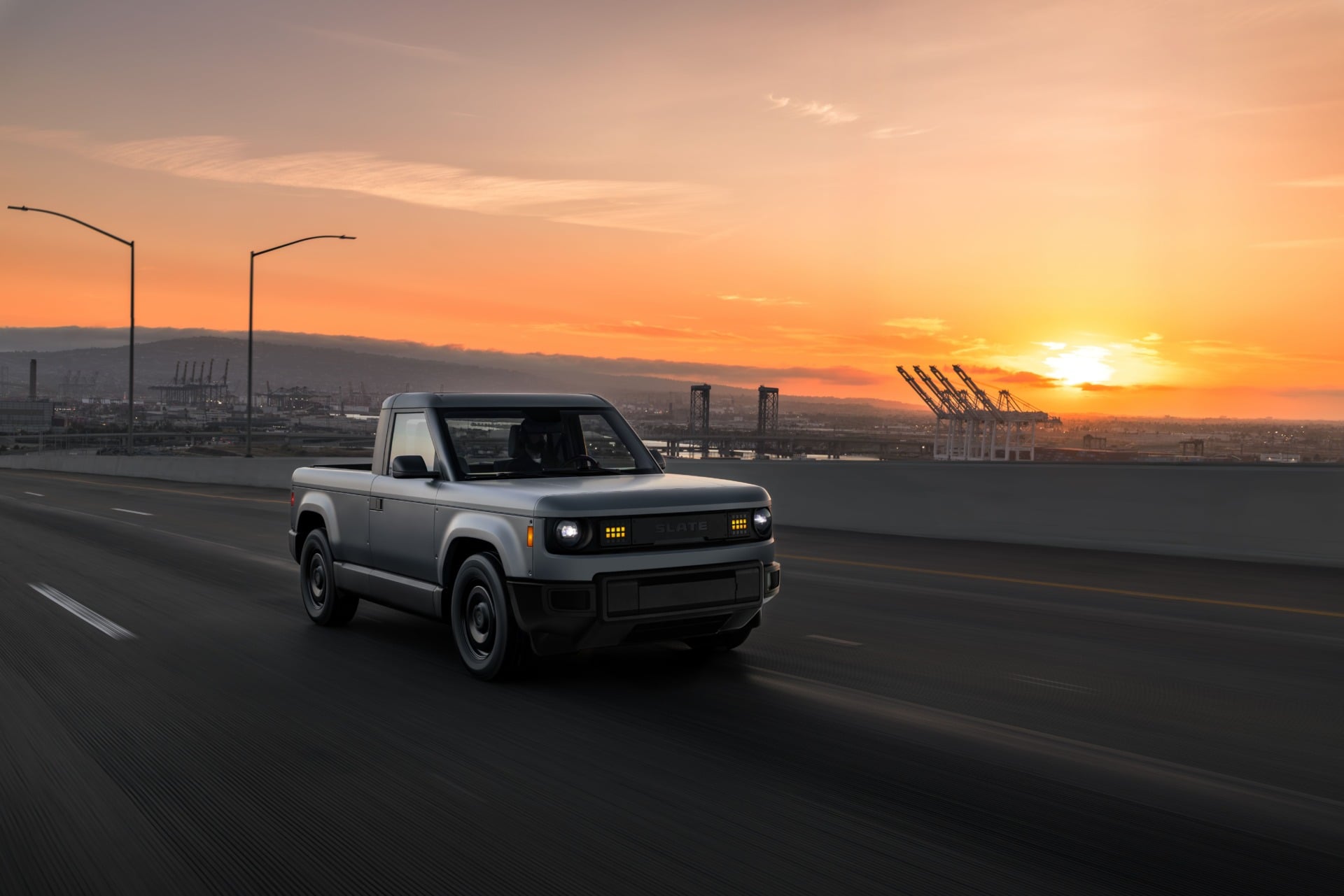 A photo of Slate auto's EV truck on a highway.