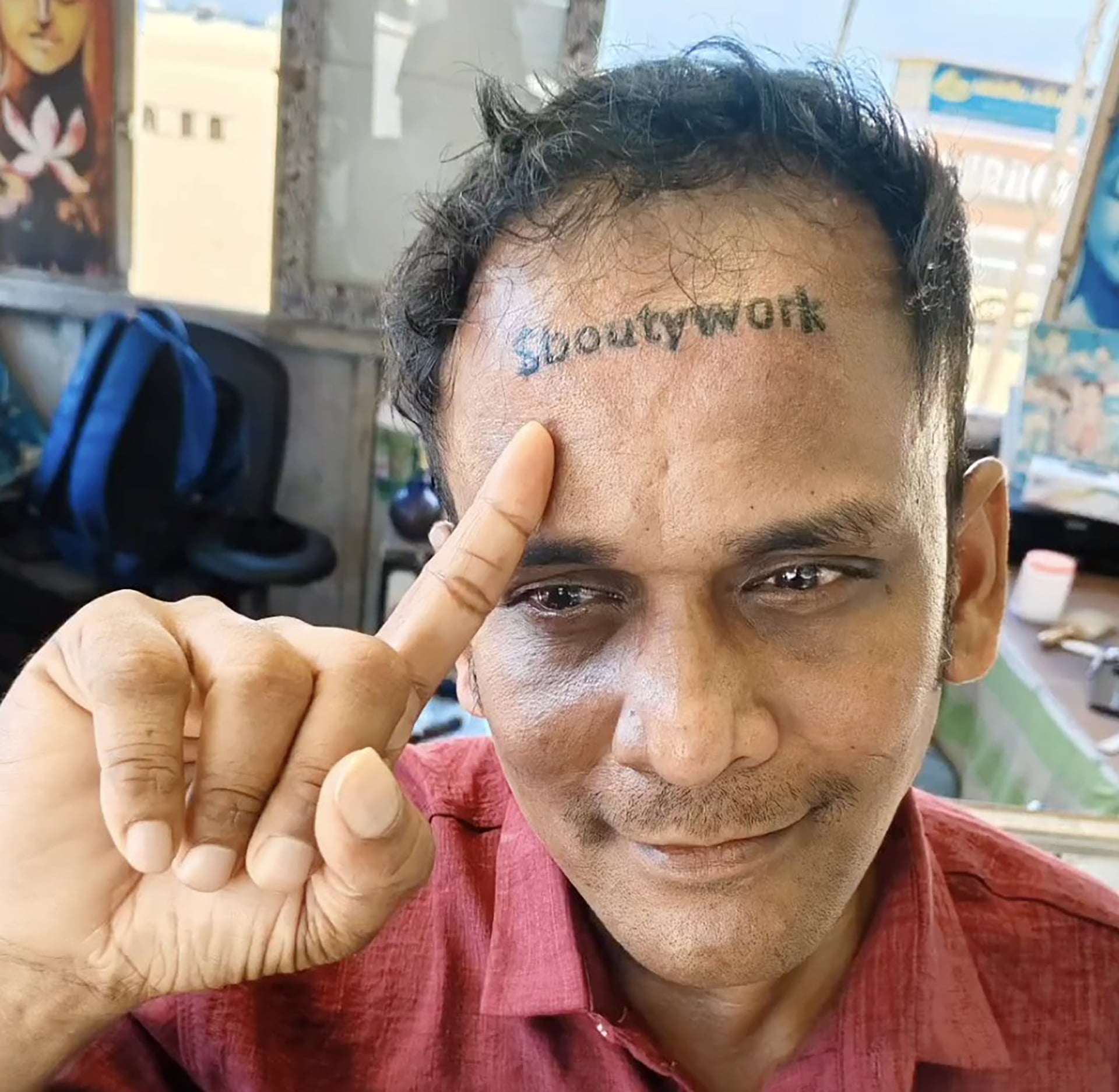 Man with $boutywork tattoo