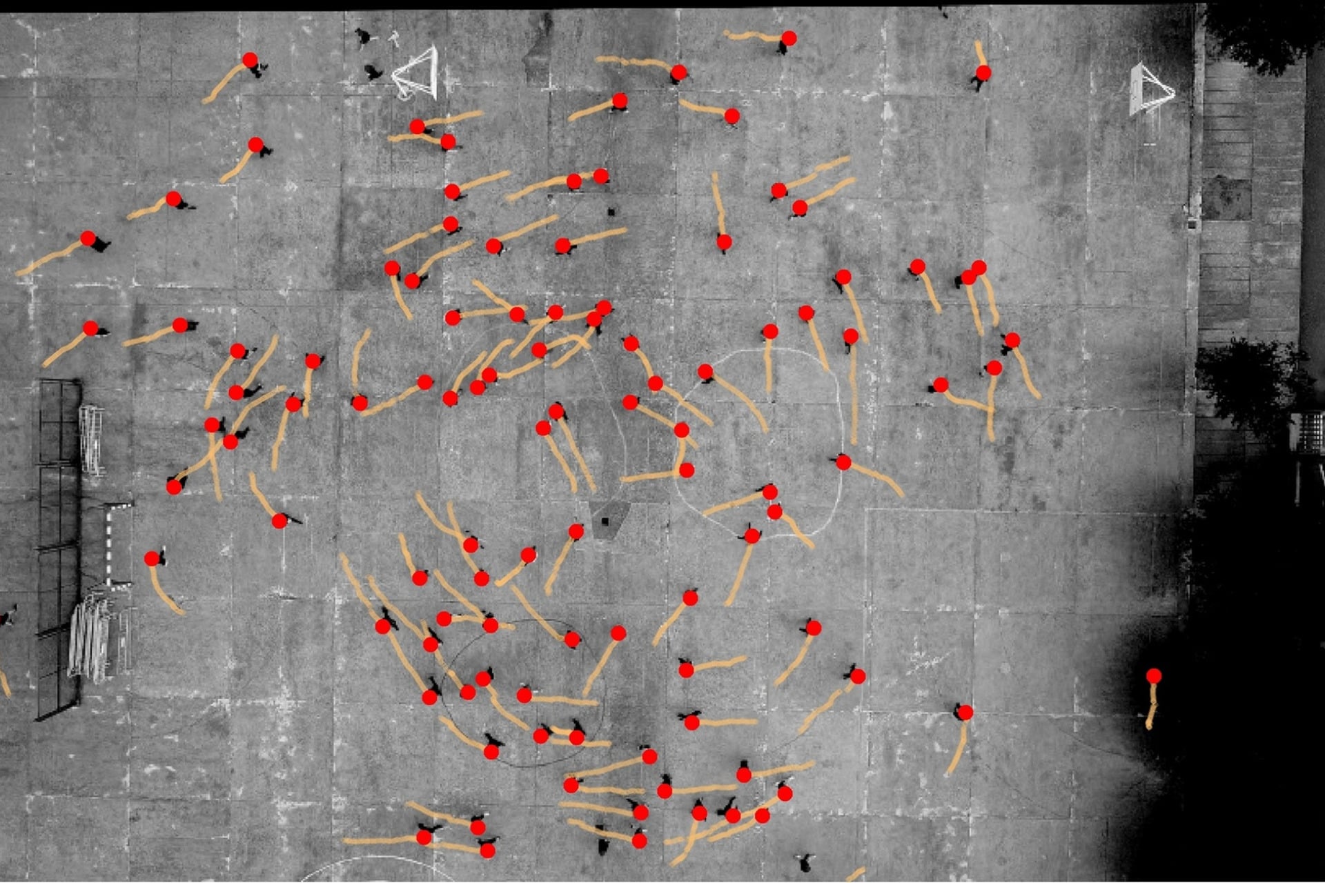 Taken from above, this annotated image shows a schoolground in Spain and the motions of teenage participants as indicated by the dots and lines.