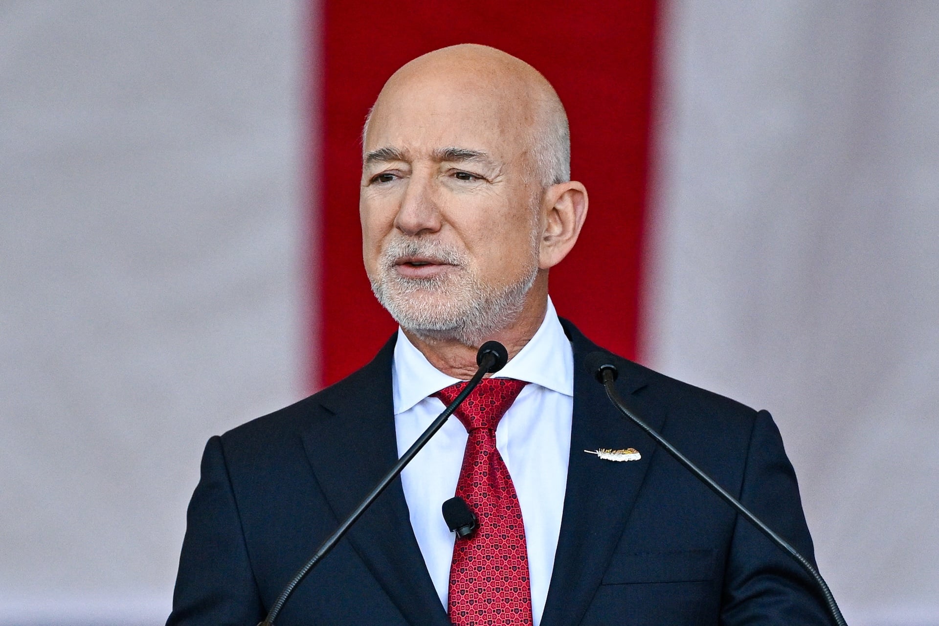 Blue Origin CEO Jeff Bezos speaks onstage ahead of US Defense Secretary Pete Hegseth at Blue Origin in Cape Canaveral, Florida, on February 2, 2026. 