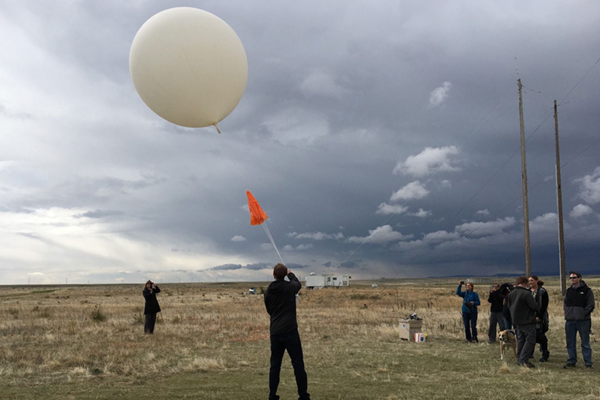 CIRES scientist Patrick Cullis releases a weather balloon carrying an ozonesonde from NOAA's Marshall Mesa near Boulder, Colorado. 