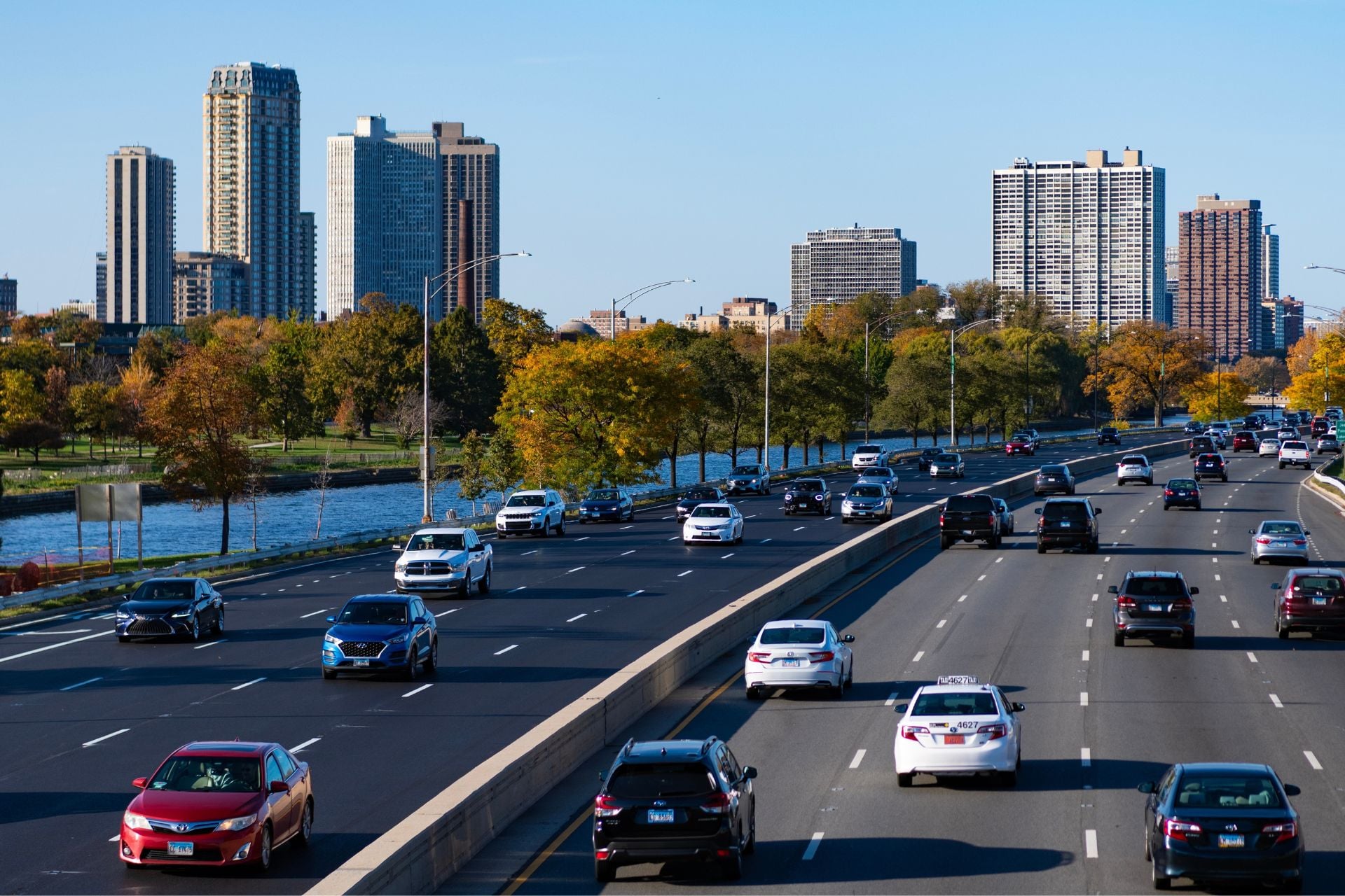 Cars drive down a busy highway in Chicago, Illinois. 