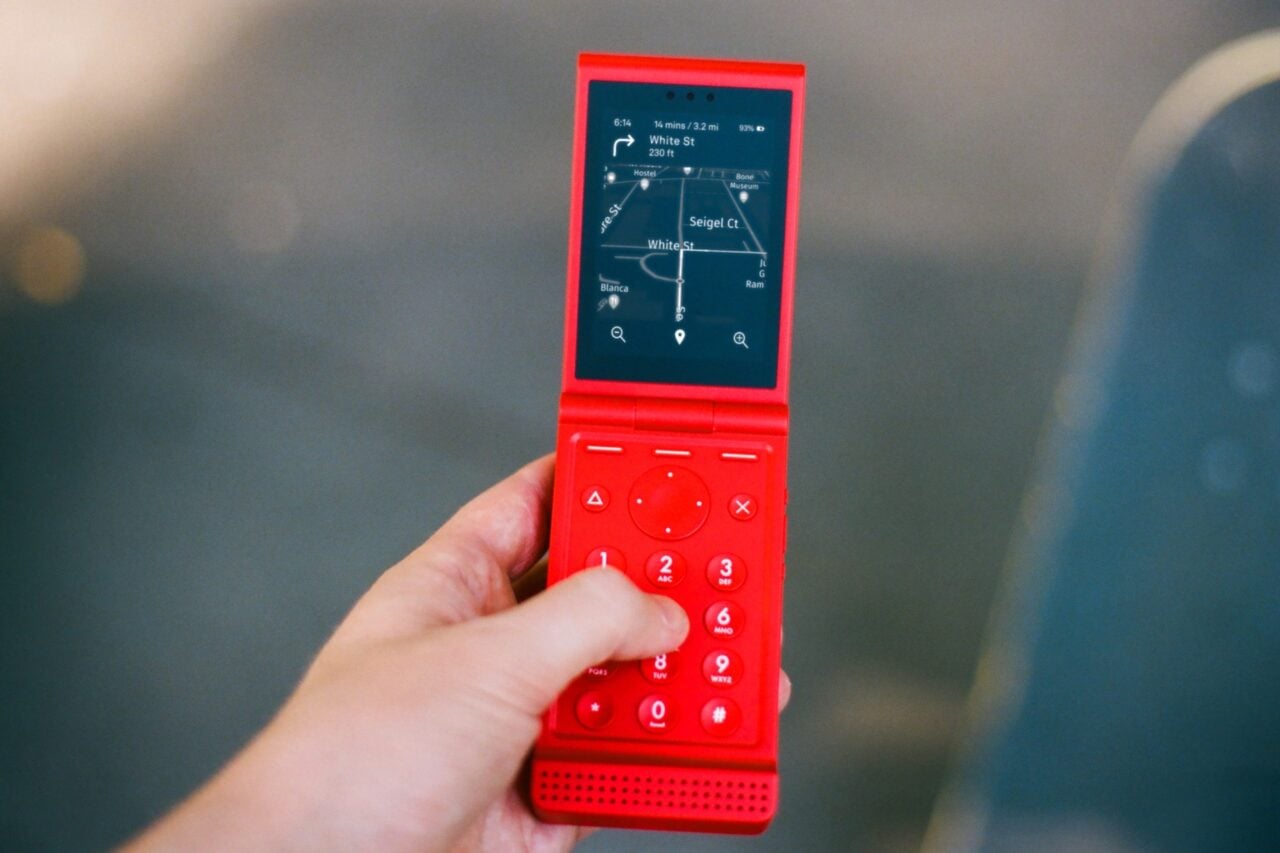 A Light Flip phone in red showing Google maps