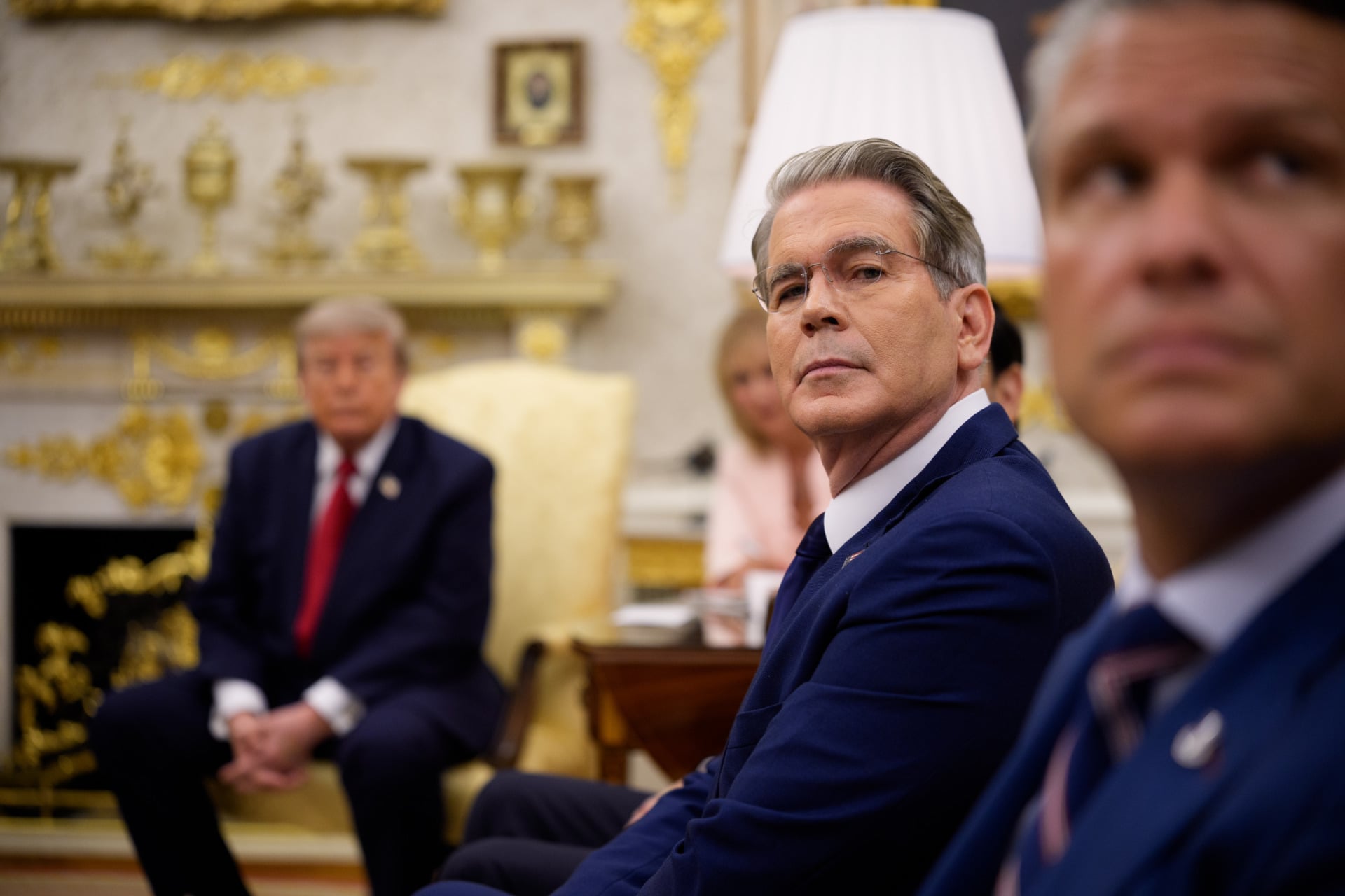 Treasury Secretary Scott Bessent with President Trump in the background
