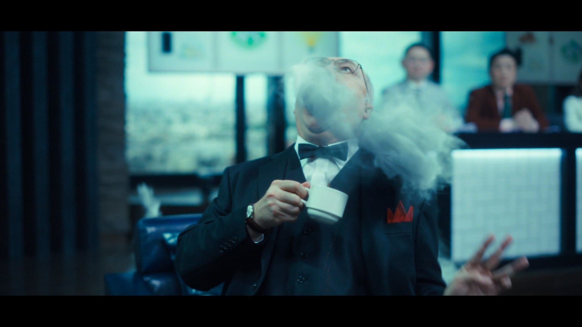 Human Vapor still of a man being invaded by smoke.