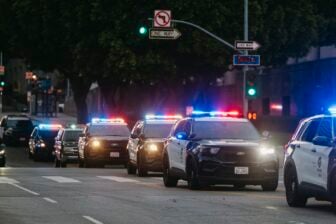 Police cars are on the scene as anti-ICE protests continue in the presence of LAPD and US National Guard forces in Los Angeles, California, on June 12, 2025.