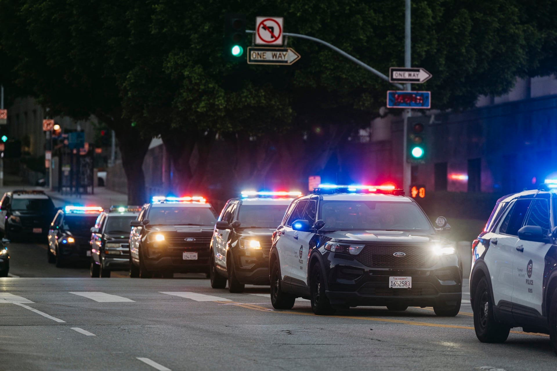 Police cars are on the scene as anti-ICE protests continue in the presence of LAPD and US National Guard forces in Los Angeles, California, on June 12, 2025.
