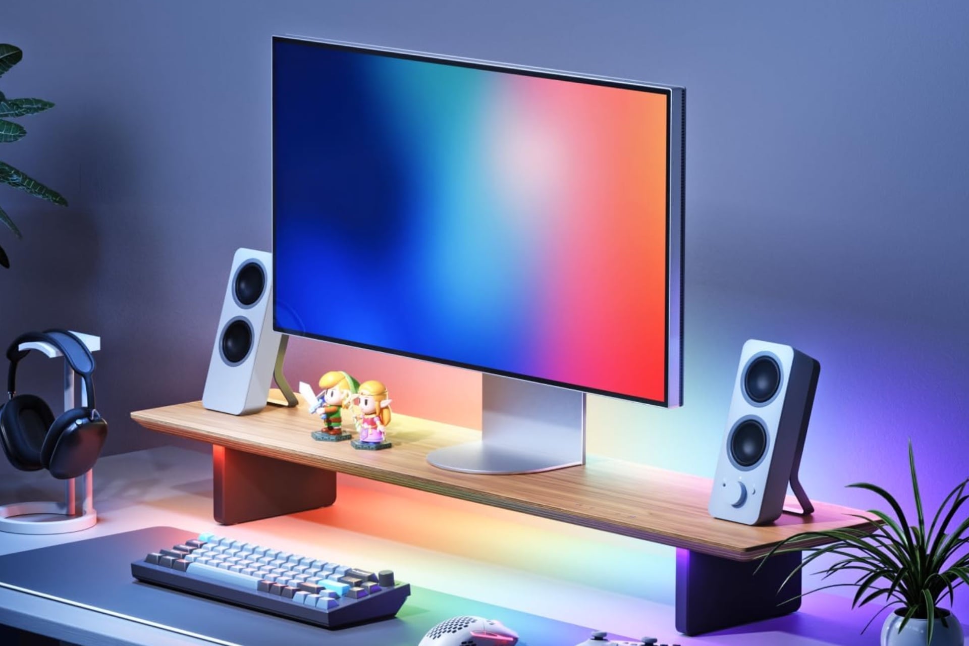 Render of the Nanoleaf Smart Led Monitor Stand on a desktop with a display and speakers on it.