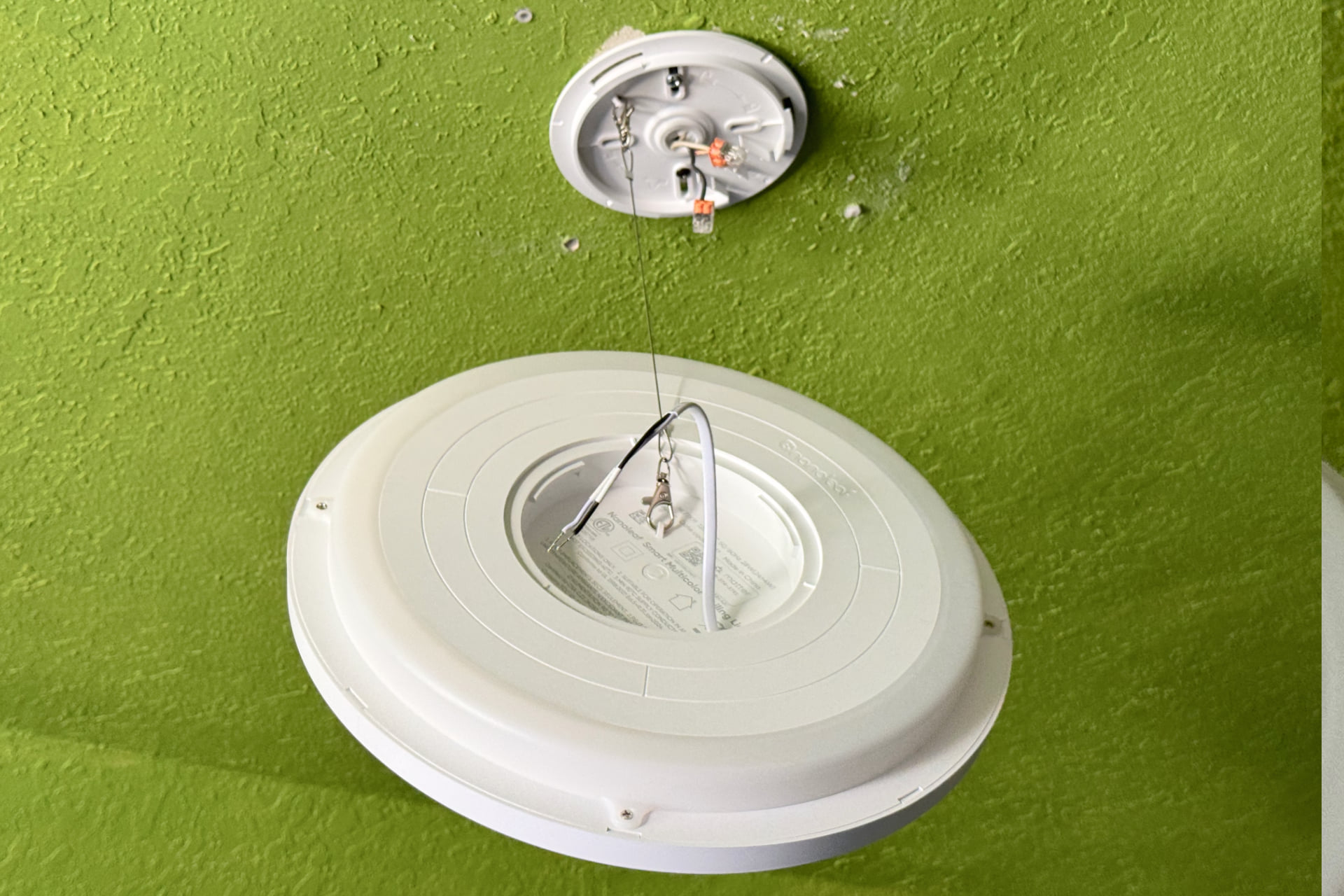 Nanoleaf Smart Multicolor Ceiling Light dangling during installation