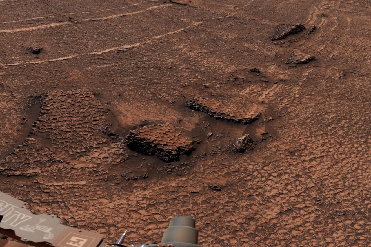 Martian landscape covered in honeycomb-shaped surface features